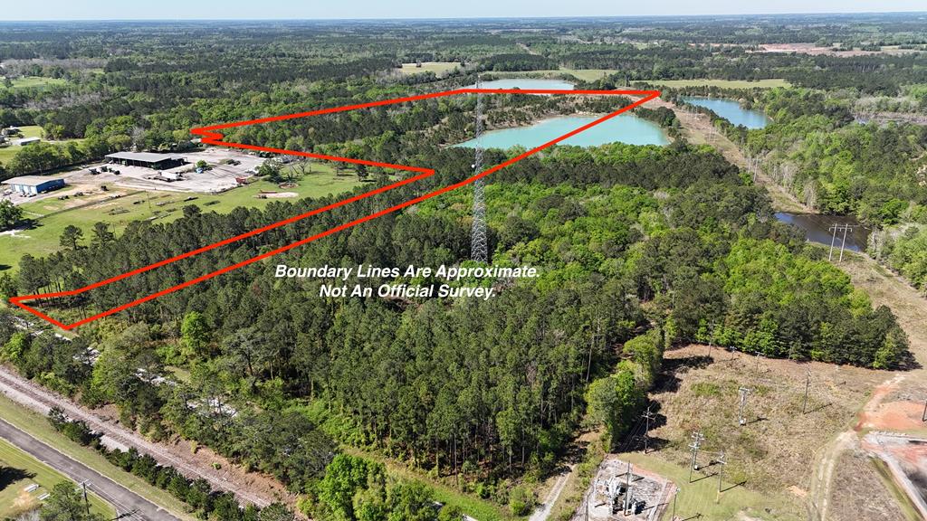 Check out this awesome 40+/- acre tract located in North West Thomas County just outside the city of Ochlocknee, GA! Paved road frontage on GA Hwy 3! This beautiful land has a mix of everything! Uplands, hardwoods, pines, lakes, etc. The soil was rich in minerals therefore some of the land has previously been mined. The result of the mining are some gorgeous lakes! One in the center of the property, and another near the SW boundary corner! These are truly magnificent lakes! Not to mention they would be extremely difficult, and costly to duplicate! The land is completely high and dry with the exception of the lakes. The land is located in flood zone X which means not in the flood zone! There are no wetlands/swampland on the property per the wetlands map. There is some open land around the perimeters of the lakes. The rest of the land is heavily wooded with a mixture of hardwoods, and pines. There are numerous potential uses for this great property! This would make an amazing recreational tract! Stock the lake! Enjoy hunting, fishing, and ATV/UTV riding! Excellent whitetail deer, wild turkey, and small game hunting. I would imagine there are some decent waterfowl opportunities as well with the lakes. Use the property for agricultural purposes. Great potential for farming. Harvest the timber, and replant. This would also be a great location for a solar farm. There is a Georgia Power substation adjacent just to the north. There is also an electrical transmission line that runs just to the north. This parcel will be surveyed out of a larger tract. There is a total of 80+/- acres available for sale. The entire 80+/- acres can be purchased for $430,000. Ochlocknee, Thomasville, Moultrie, and Bainbridge are all nearby!