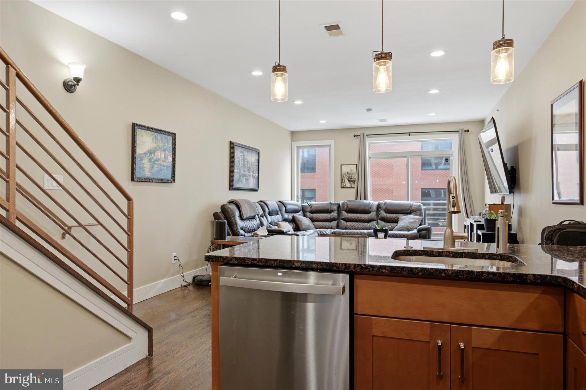 Elevate your urban lifestyle at 844 N 15th Street, Unit C, a sophisticated three-bedroom, 2.5-bathroom residence that perfectly captures the energy of Philadelphia’s skyline. Spanning 1,444 square feet of meticulously designed living space, this bi-level condo is engineered for the modern professional who seeks a seamless transition between a high-functioning workspace and a premier entertaining venue. The experience begins on the open-concept main floor, where high ceilings and a signature Juliet balcony flood the interior with natural light and fresh city air. The heart of the home is a stylish, chef-ready kitchen featuring granite countertops, a sleek tile backsplash, and a versatile breakfast bar that effortlessly serves as a casual morning workspace or a hub for evening cocktails. This level’s expansive living and dining area provides the generous footprint necessary for both quiet nights in and lively social gatherings, all anchored by contemporary finishes and recessed lighting.The upper level is dedicated to rest and productivity, housing three well-proportioned bedrooms that cater to a variety of lifestyles. The primary suite serves as a serene retreat with ample closet space and a spa-inspired ensuite bath, while the additional two bedrooms offer the essential flexibility required for a growing family or a dedicated "double-desk" home office setup. However, the true showstopper is found just beyond the striking central spiral staircase: a massive, private rooftop deck that offers breathtaking, panoramic views of the Philadelphia skyline. Whether you’re hosting summer sunset dinners or enjoying a private outdoor workout, this sky-high sanctuary provides a level of peace and perspective rarely found in the city center.Positioned in the geographic "sweet spot" of Francisville, this home places you exactly where you want to be—just a short stroll from the historic Met Philadelphia, the artisan cafes of Fairmount Avenue, and the world-class galleries of the Art Museum District. With a 100/100 Walk Score and a two-block walk to the Broad Street Line, your commute to Center City or University City is measured in minutes, not miles. While the new-construction frenzy of the neighborhood continues, 844 N 15th stands as a proven, high-performance asset with a stabilized HOA and a location that continues to appreciate as the city’s hottest corridor. This is more than a home; it is a strategic vantage point from which to experience the very best of Philadelphia.