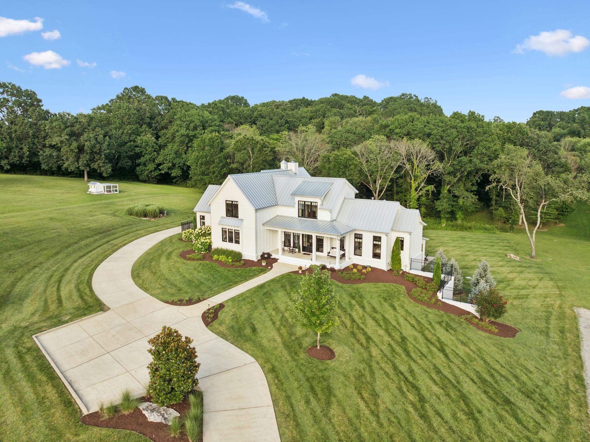Welcome to 2650 Finley Ridge Lane – A Custom Modern Farmhouse Estate on 44.85 Acres  Experience refined country living just minutes from the heart of Nolensville. This stunning custom-built modern farmhouse, completed in 2018, offers over 5,352 square feet of thoughtfully designed living space, perfectly situated on nearly 45 private acres of rolling hills, pastures, and a picturesque pond.  Inside, you'll find 4 spacious bedrooms, 5.5 bathrooms, plus a flex room ideal for a home office, craft space, or 5th bedroom. The open-concept layout is designed for both everyday living and entertaining on a grand scale. The gourmet kitchen features high-end appliances, custom cabinetry, and a large center island, flowing seamlessly into expansive living and dining areas with hardwood floors and a cozy fireplace.  The finished walkout basement is a host’s dream—complete with a full bath and bar area—while the outdoor living spaces take entertaining to the next level. Enjoy the private pool and spa, or unwind on the motorized screened-in back porch with a built-in outdoor grill, perfect for relaxing Tennessee evenings.  Car enthusiasts, hobbyists, and equestrian lovers will appreciate the oversized garage with unfinished loft, a 36' × 56' barn with hay loft, and a 40' × 66' three-bay shop with a 10' × 40' covered porch and drive-through access. A ¾-acre seasonal pond, rolling terrain, and two additional septic sites provide exceptional potential for a multi-generational estate and or guest homes.  This is more than a home—it's an entertainer’s dream and a rare opportunity to own a private estate with unmatched amenities, space, and natural beauty.  School Zone (Williamson County Schools):  Nolensville Elementary (PK–5)  Mill Creek Middle (6–8)  Nolensville High School (9–12) https://properties.615.media/sites/engmejg/unbranded