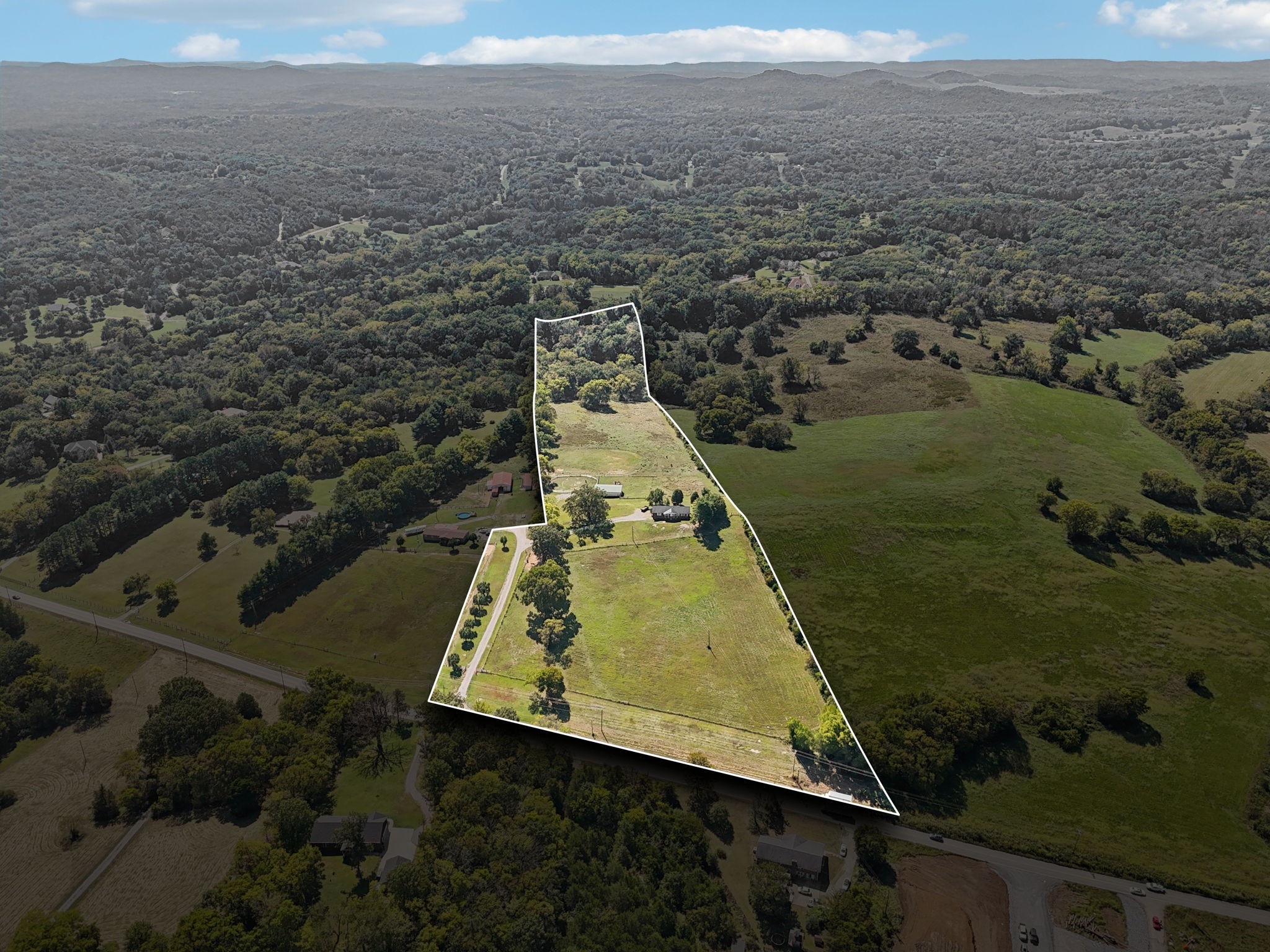 Welcome to 7661 Rocky Fork Road, a rare 15.2-acre opportunity in the heart of Smyrna. This one-of-a-kind property combines the tranquility of open land with the convenience of being close to everything.The property features a classic 3-bedroom, 2-bath all-brick ranch home with an inviting open floor plan and a full walkout basement—perfect for adding additional living space or creating a private retreat.Outside, the land speaks for itself: rolling pastures, fully fenced for livestock, and a barn ready for animals or equipment. Whether you’re dreaming of a hobby farm, a private homestead, or space to simply enjoy the outdoors, this acreage provides endless possibilities.What makes this property truly special is its potential. Not only can you make the existing home your forever residence, but with its prime location and size, there may also be future opportunities for development or investment.Properties like this rarely come to market—don’t miss the chance to make this slice of heaven your own.