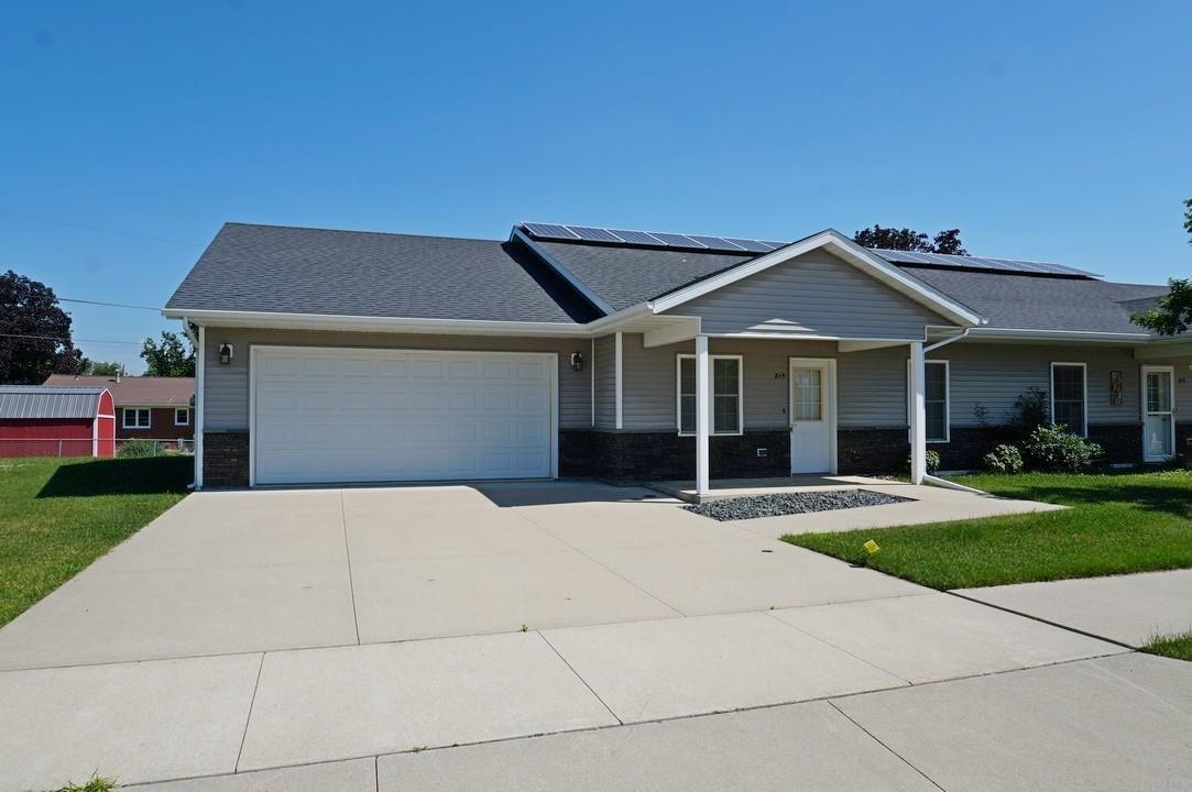Easy living and energy efficiency are designed into this modern twin home. A covered front porch offers zero-entry access to the home. The great room opens into the kitchen featuring stainless steel Energy Star® appliances and a breakfast bar. The kitchen flows to a dining room with a walkout to the back covered porch. A spacious ¾ bath and laundry/utility room are conveniently located between to the 2 bedrooms. The heated attached 2-car garage (21 ft x 29 ft) has space for vehicles and storage. Super energy-efficient construction with solar and geothermal in-floor heat provides ultra-low energy bills! Parkside Development HOA includes neighborhood greenspace, lawn care and snow removal.  Low maintenance, low-cost living awaits!