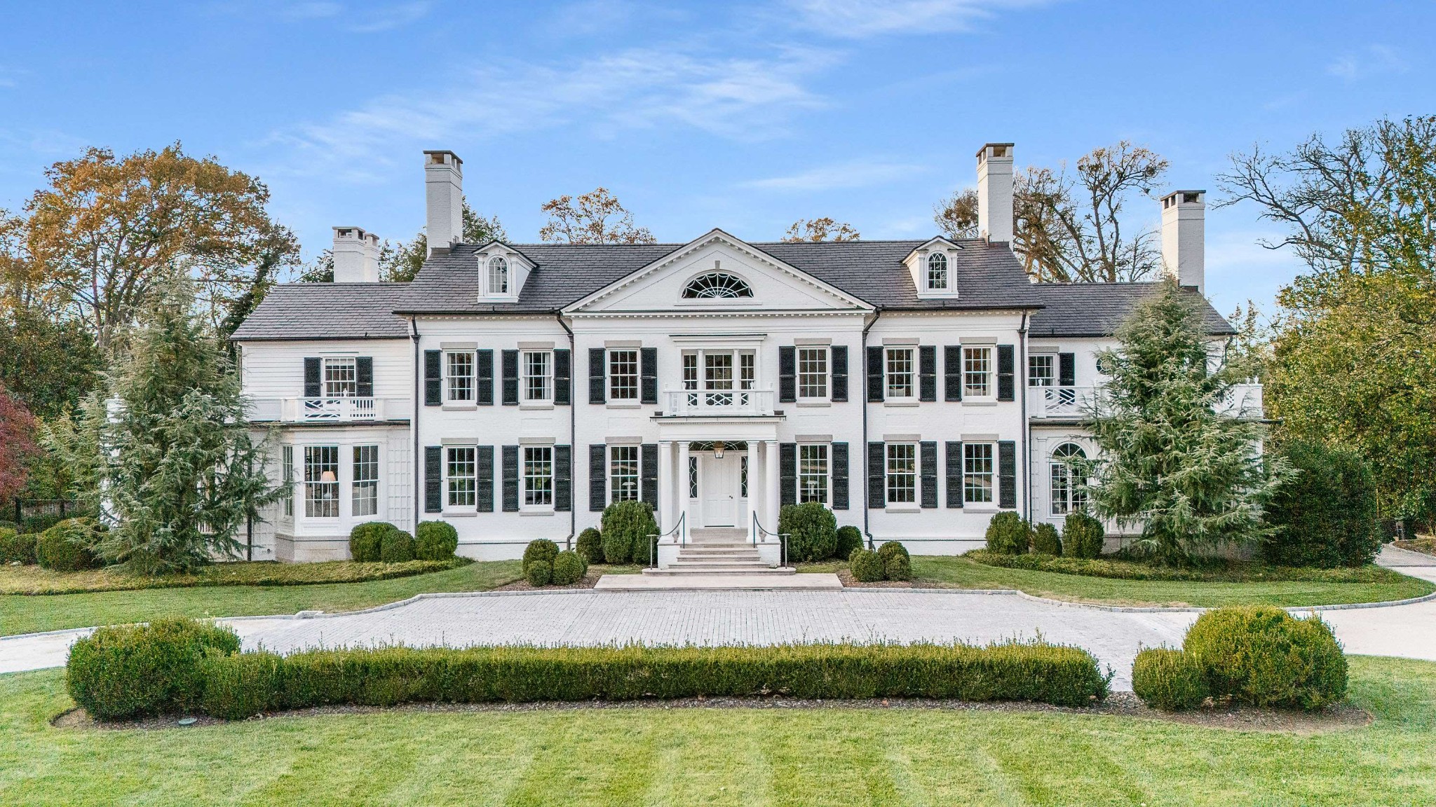 A timeless and elegant residence in the heart of Belle Meade, this stately home blends historic charm with refined Southern living. Designed by renowned architect Jim Strickland, the home is filled with gracious living spaces, rich architectural details, and luxury finishes throughout. Thoughtfully selected wallpaper and designer hardware bring an added layer of detail and refinement to the interiors.The bright and beautifully designed kitchen features high-end finishes, abundant natural light, and a large island that anchors the space for both everyday living and entertaining. Natural light fills the primary suite, complete with a relaxing sitting area and freestanding soaking tub. Three additional spacious bedrooms upstairs offer comfort and flexibility for family and guests, each designed to feel warm, inviting, and filled with natural light.The lower level offers additional flexible space for a seating area, recreation, or future customization, along with a wine cellar and safe room. The grounds are beautifully maintained and centered around a graciously scaled pool and guest house, making the outdoor spaces feel just as inviting as the interior. With multiple indoor and outdoor gathering spaces throughout, this home is an entertainer’s dream- thoughtfully designed for everything from intimate dinners to larger-scale entertaining.Classic and timeless, this remarkable home embodies the character and elegance of Belle Meade living, with a presence that speaks for itself.