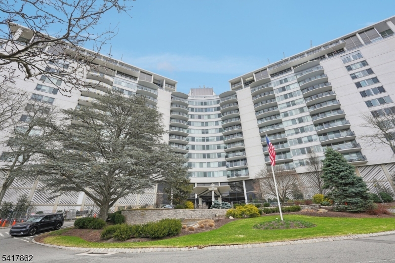 Isn't it time you pulled right up to your front door & had valet park your car? Welcome to the luxury lifestyle you deserve!Enjoy breathtaking mountain views from this spectacular 1-bedroom, 1.1-bath condo offering true resort-style living. Unwind on your private glass-enclosed balcony, perfectly positioned to take in stunning panoramic vistas. Inside, a sun-filled open-concept living room, dining area and kitchen layout. The kitchen is a true showstopper, highlighted by a striking blue onyx-inspired porcelain backsplash, a piece of art, paired with a quartz island offering additional cabinetry and seating for four. Top-of-the-line appliances, including Bertazzoni built-in oven bring Italian design to the heart of the home. The primary suite is a luxurious retreat, featuring a full bath with a separate soaking tub, walk-in shower with rain and spray fixtures, a state-of-the-art smart toilet with heated seat, nightlight, hands-free operation, automatic flush, and touchscreen remote. A beautifully designed vanity and medicine cabinet complete the space. Mahogany floors and high-end lighting fixtures throughout make this truly turnkey, and one of the finest one bedroom units in the building. Enjoy full-service living with 24/7 concierge, valet parking, gym, pool, tennis, and community room, all included in maintenance. Monthly HOA fee includes your heat, electric, water, sewer, and amenities.