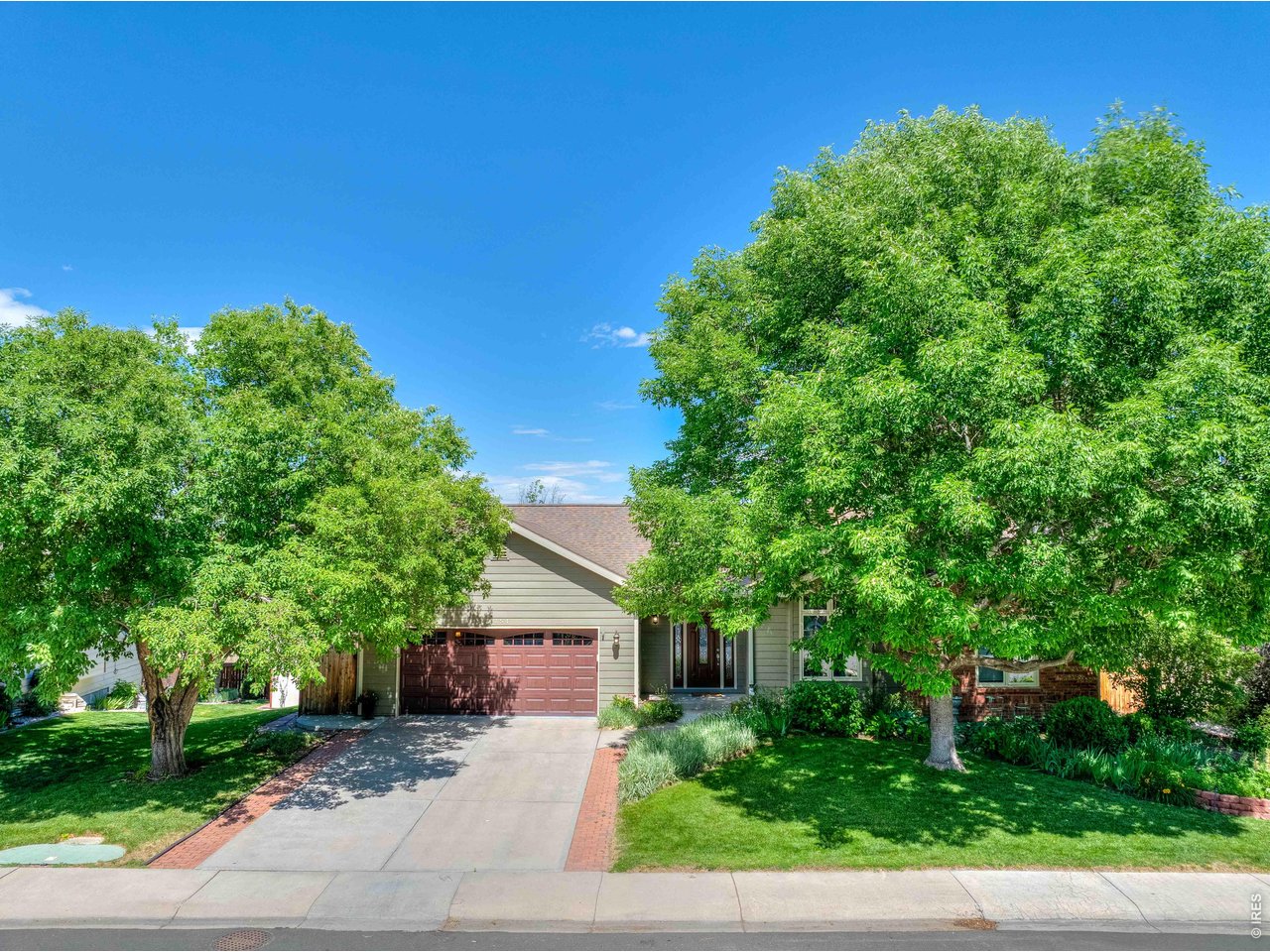 Welcome home to this beautiful walkout ranch in Southeast Fort Collins! From the moment you step inside this four-bedroom home, you'll appreciate the light-filled, open-concept living space featuring gorgeous engineered wood floors, a cozy gas fireplace, and expansive windows that fill the home with natural light. Enjoy seamless indoor-outdoor living with both an elevated back deck and a spacious lower patio-perfect for relaxing or entertaining. Desirable location near Southridge Golf Course, Fossil Creek Park and backing to a natural area with no neighbors directly behind. The main level includes three bedrooms, one currently configured as a home office, along with a serene primary suite featuring direct access to the back deck. The expansive finished walkout basement provides incredible versatility, offering abundant space for entertaining, recreation, hobbies, or comfortable multi-generational living. Lovingly maintained by the same owner since 2003, this home has been meticulously cared for and is truly move-in ready. Don't miss your opportunity to make this exceptional property your next home.