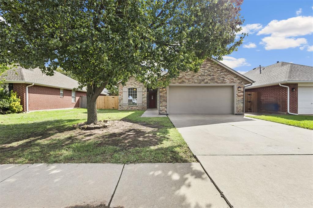 Welcome to this charming home in the Copper Creek addition. This three bedroom, two bath home offers a desirable split bedroom floor plan designed for comfort and privacy. The spacious primary suite includes a shower tub combination and walk in closet, while the two additional bedrooms share a full bathroom. The large living room offers a cozy gas fireplace and wall of windows that fill the space with natural light. A separate office or study overlooks the front yard, ideal for working from home or a quiet retreat. The kitchen includes an electric cooktop and oven, dishwasher, microwave, small island, and convenient dining area, plus a walk-in pantry. A garden door opens to the side covered patio, creating an inviting outdoor space. This charming home offers a functional layout, comfortable living spaces, and desirable features for everyday living.