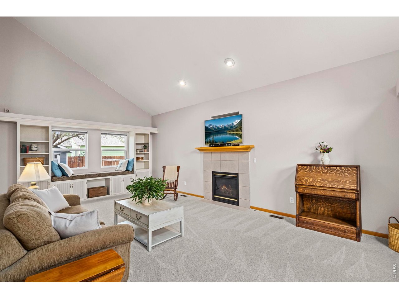 Welcome home to this beautifully maintained gem in desirable English Ranch. Ideally located just minutes from neighborhood schools, parks, trails, shopping, and entertainment, this standout home offers comfort, style, and everyday convenience. From the moment you step inside, you'll appreciate the soaring vaulted ceilings, abundant natural light, open floor plan, new carpeting, and real wood floors. The inviting great room features a cozy fireplace and a custom window seat framed by built-in bookshelves and cabinetry, creating both charm and functional storage.The updated kitchen is a true highlight with painted two-tone cabinetry, a contrasting island with breakfast bar, granite countertops, updated fixtures, stainless steel appliances, double ovens, and a pantry cabinet. The generous dining area opens to a covered patio, perfect for dining outdoors and enjoying the mature landscaping, lovely gardens, and peaceful sound of a trickling fountain.Upstairs, the vaulted primary retreat offers a relaxing escape with an updated bath featuring dual sinks and a walk-in closet. The secondary bedrooms are spacious and move-in ready. The finished basement adds exceptional flexibility with a large rec room, fourth bedroom, study area, and a charming 3/4 bath with wainscoting and pedestal sink.Additional highlights include convenient main-floor laundry, garage shelving for extra storage, and an adorable backyard shed ideal for tools, toys, or gardening supplies. This is a home with heart, and you'll feel it the moment you walk in