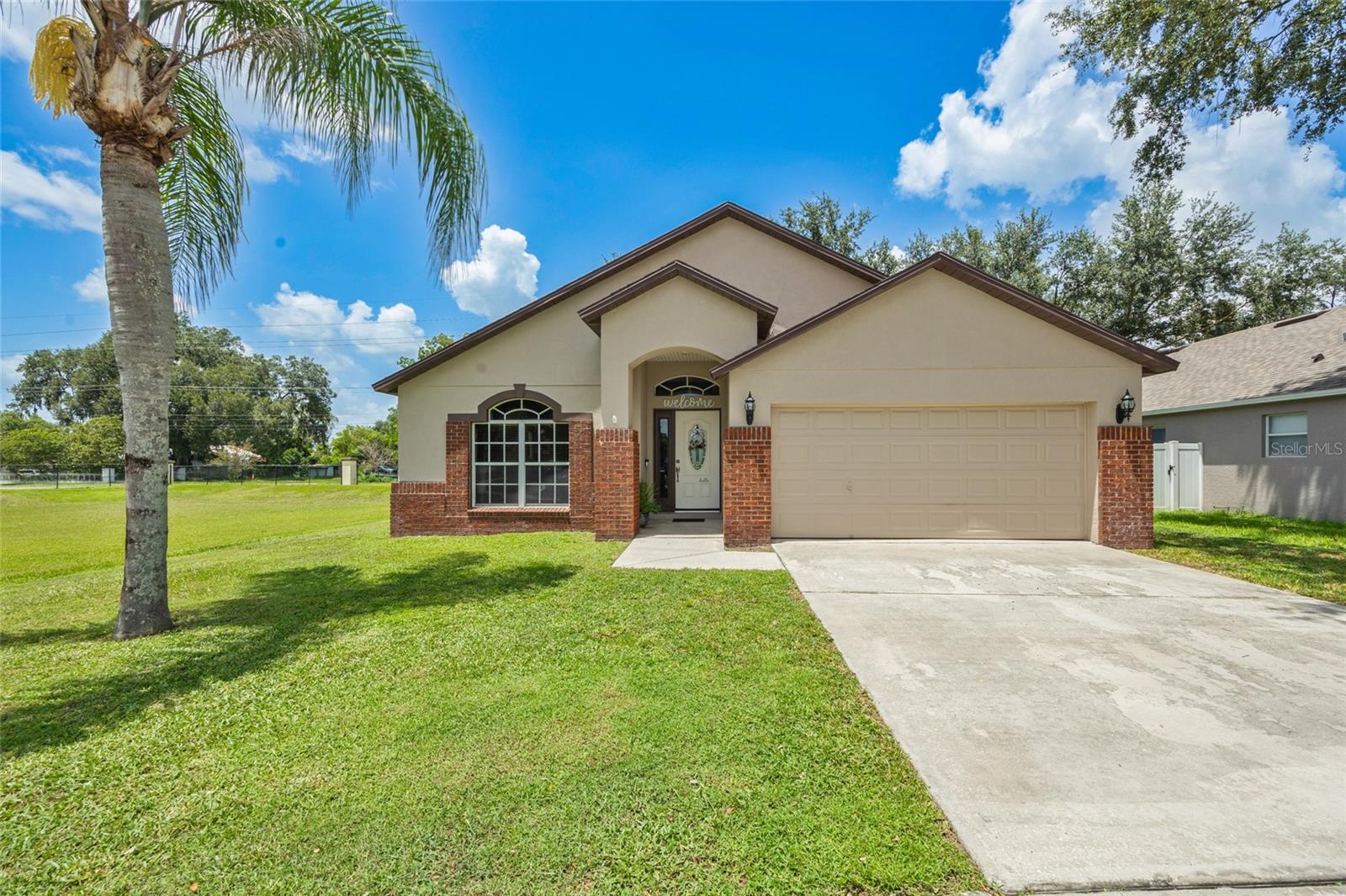 Charming Corner-Lot Cottage in the Heart of Plant City.  Step into this fully refreshed farmhouse-style retreat featuring three beatufiul bedrooms, two spacious bathrooms, and a bright, breezy open floor plan perfect for gatherings and everyday living.  The Jack and Jill bathroom creates convenient connectivity while maintaining privacy. Built in 2005 and boasting a brilliant blend of rustic charm and modern upgrades, this home has been throughfully transformed from top to bottom.  The kitchen is a culinary dream with sleek stainless steel appliances, gorgeous granite-style countertops, and cozy custom brickwork that sets the tone for timeless taste.  Set on a prime corner lot in picturesque Plant City-Florida's famous strawberry capital-this home primises sweet Southern living. A brand-new roof will be installed before closing, providing peace of mind and polished curb appeal. Don't miss this stylish, stunning, and story-perfect space ready to welcome its next lucky owners!