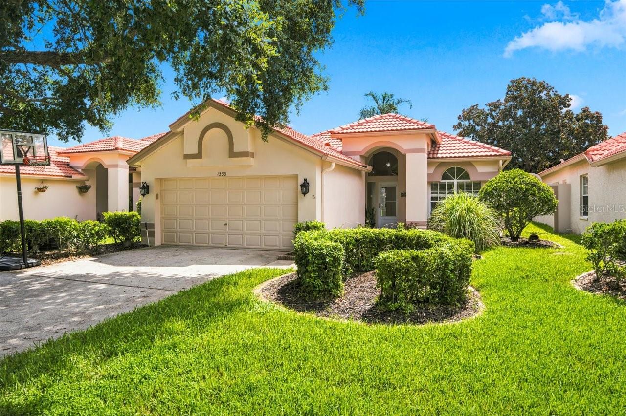 New roof, major system updates, and maintenance-free living—all within the guard-gated golf course community of Crescent Oaks. This move-in ready home offers the perfect opportunity to enjoy modern updates today while adding your own personal style.Step inside to discover a thoughtfully maintained home featuring an updated kitchen, renovated primary bathroom with stylish finishes, a new vanity in the secondary bathroom, a newer HVAC system, new water heater, and the peace of mind that comes with a new roof. To help make the home your own, the seller is offering a $7,500 credit toward new flooring, giving you the flexibility to choose finishes that perfectly match your taste.Outside, enjoy the convenience of maintenance-free lawn care, allowing you more time to experience everything this exceptional community has to offer. Crescent Oaks is one of the area's premier 24-hour guard-gated golf course communities, celebrated for its majestic oak trees, tranquil ponds, lush landscaping, and beautifully maintained streets. Whether you enjoy golf, peaceful evening walks, or simply relaxing in a picturesque setting, you'll appreciate the lifestyle and sense of community that make Crescent Oaks so desirable.Ideally located near shopping, dining, medical facilities, parks, Gulf beaches, and Tampa International Airport, this home combines comfort, convenience, and lasting value. With significant recent updates already completed and a generous flooring credit to customize the finishing touch, this is an exceptional opportunity to create a home that's uniquely yours.