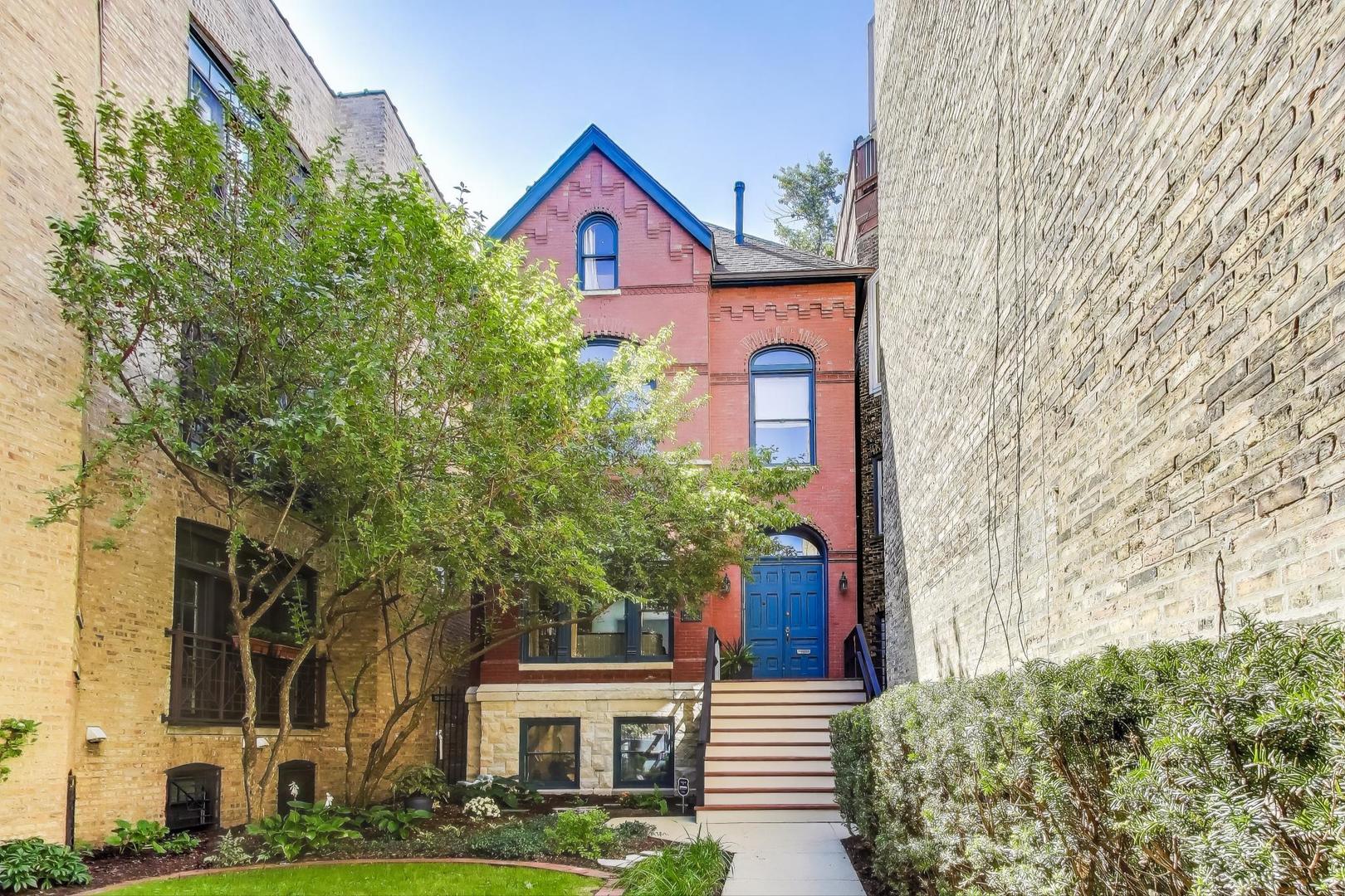 Stunning East Lakeview Home: A Masterpiece of Timeless Elegance!  Step into a world of sophistication and style in this extraordinary 4-story, 5 bedroom classic red brick Queen Anne nestled in the coveted East Lakeview neighborhood. This property, situated on a generous 150 ft deep lot, is a rare opportunity to own a piece of architectural beauty from 1886 that seamlessly combines modern luxury with classic design.  Upon entering, you're greeted by the grace and nostalgia that define this home with restored original wood work. Featured in Metropolitan Home as "Home of the Year" after its meticulous renovation in 1987, this home now boasts a spectacular first-floor renovation from 2017 that redefines luxury living. The culinary enthusiast will be enamored with the show-stopping kitchen, featuring an impressive 9.5 foot slab of marble as its centerpiece island. Tailored for the modern chef, this custom-designed kitchen includes top-of-the-line appliances, including a 6-burner Wolf stove with a custom range hood, a Wolf steam convection oven, a warming drawer, and a vintage-style custom pantry door, all artfully arranged for both functionality and aesthetic appeal.  Flowing effortlessly from the kitchen, the dining room and great room create an inviting space for entertaining. Custom Amish hutch, cabinets & built-ins all adorned with gorgeous marble counters! A magnificent two-story atrium bathes the space in natural light and leads you to a beautifully designed bluestone patio, perfect for al fresco dining. The professionally landscaped yard, complete with a sprinkler system and mature trees offers an ambiance of tranquility and privacy-ideal for hosting gatherings or simply unwinding in nature. Plus you will love the added convenience of a 2 car garage.  The second-story living room/parlor is a true gem, anchored by the home's original mantel that has been lovingly restored. This inviting space overlooks the dramatic great room and landscaped yard, creating a perfect backdrop for both quiet evenings or lively entertaining.    Retreat to the primary suite, which is a haven of relaxation featuring not one, but two spacious walk-in closets.  The 3rd floor also offers a generous sized 2nd bedroom with a custom floor to ceiling wood book case. Enjoy serene tree top views of the professionally landscaped outdoor oasis from here. The fourth floor adds even more versatility with a cozy den or 3rd bedroom and two additional bedrooms, allowing for ample space to accommodate family and guests.    This home is not just a place to live; it's a lifestyle. Experience the harmonious blend of classic elegance and contemporary living in this 5 bedroom home.