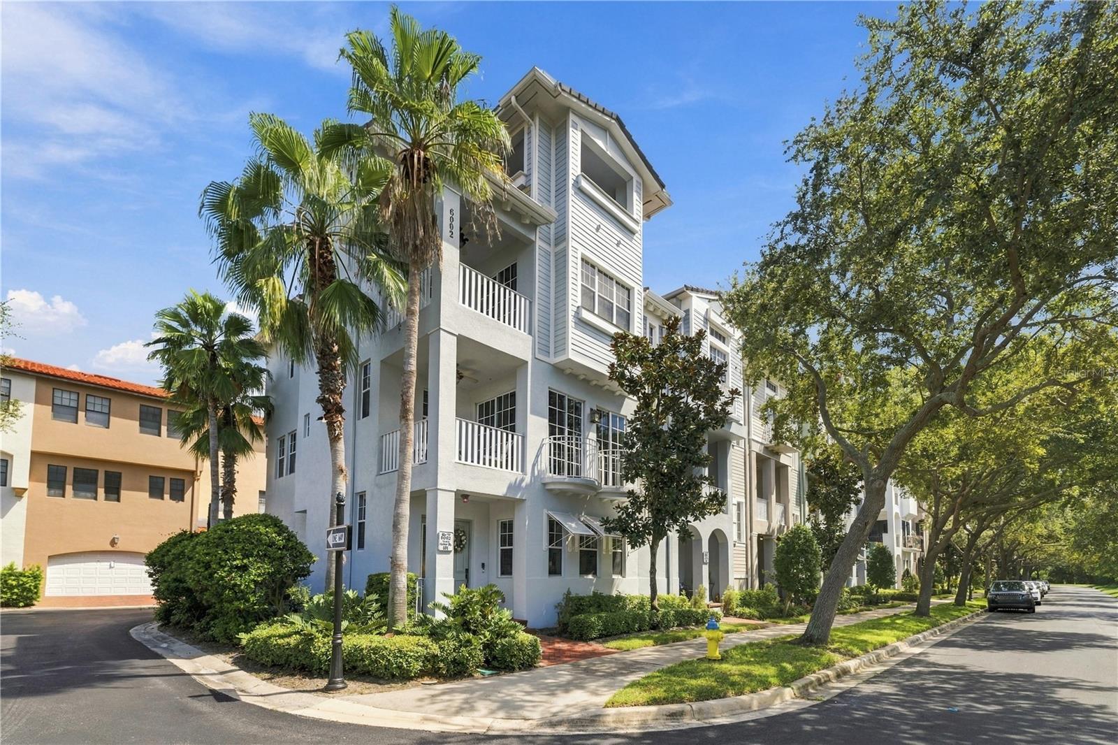 Welcome to Westshore Yacht Club, where this rare 4-story end-unit townhome offers some of the most impressive water views in the entire community. One of only four townhome residences positioned to capture this particular view, the 4th-floor covered balcony overlooks Old Tampa Bay and delivers incredible sunsets and panoramic water views that simply do not translate in photographs. Offering approximately 2,138 heated square feet, 3 bedrooms plus a bonus room, 3 full baths, 2 half baths, a 2-car garage, and a private elevator servicing all four levels, this home combines flexible living space with a truly unique waterfront setting.The first floor features a private guest bedroom with an en-suite bath, ideal for visitors or a home office. The second floor offers an open and bright living area with 10-foot ceilings, crown molding, Juliet balconies, and floor-to-ceiling windows, along with a spacious kitchen featuring solid wood cabinetry, granite countertops, stainless steel appliances, a breakfast bar, dining area, and powder bath. The third floor includes the primary suite with its own covered balcony, walk-in closet, and spacious bath with dual vanities and garden tub, along with an additional guest en-suite. The fourth floor is the showstopper, featuring a bonus room and expansive covered balcony overlooking Old Tampa Bay—the perfect setting for entertaining, relaxing, or watching the sunset over the water. Recent community improvements add even more value, with the tile roofs replaced in 2026 and exterior painting scheduled to begin the first week of November 2026.This property also offers excellent flexibility as a second home or investment opportunity. Current community guidelines allow rentals with a 30-day minimum term up to three times each year, making it an attractive option for an owner who wants to enjoy the home personally while having the ability to lease it during periods of absence. Buyer to verify current leasing restrictions and association requirements.Westshore Yacht Club is one of South Tampa’s premier 24-hour guard-gated waterfront communities, featuring the exclusive Bay Club & Marina, 149 boat slips, two resort-style heated pools, outdoor tiki bar, fitness center, day spa, and more. Conveniently located near Downtown Tampa, Tampa International Airport, MacDill Air Force Base, St. Petersburg, shopping, dining, and Gulf Coast beaches. This is a rare opportunity to own one of the community’s most uniquely positioned townhomes with exceptional water views, luxury amenities, and true Florida waterfront living.