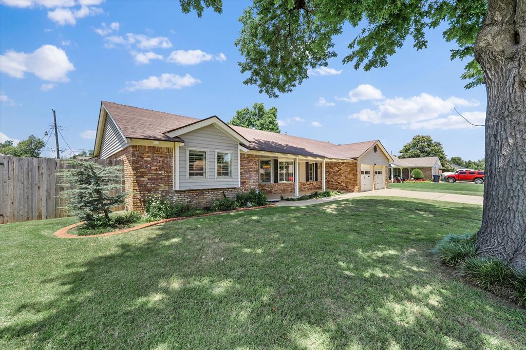 Colorful & Spacious Ranch-Style Gem in Windsor Hills – Room to Live, Play & Entertain!

Welcome to this vibrant and inviting ranch-style home offering an impressive 2,829 sq ft of thoughtfully designed living space in the highly desirable Windsor Hills Addition. Tucked away on a quiet, well-manicured street, this cheerful home is perfect for families, entertainers, or anyone seeking space, charm, and functionality.
Step inside to discover a warm, welcoming living area centered around a classic brick fireplace, ideal for cozy nights. The modern kitchen is a dream, featuring stainless steel appliances, a gas stove, sleek stainless steel countertops for easy cleanup, and tons of storage. Highlights include a huge walk-in pantry filled with top to bottom shelving, a separate spice cabinet/pantry, and an appliance cabinet to keep your countertops clutter-free.
Each of the 3 spacious bedrooms offers dual closets, providing ample storage. The primary suite is truly oversized, offering a relaxing retreat with a private en suite bath featuring a double vanity, tub/shower combo, stand-up shower, and a large walk-in closet. The guest bath and half bath are thoughtfully placed and offer even more hallway storage for convenience.
This home is packed with bonus spaces:
Family/Game Room – ideal for movie nights, gaming, or hosting guests
Guest Room with large sun-filled windows
Spacious Laundry Room with abundant cabinetry, stainless sink, and extra storage
Enjoy indoor-outdoor living with a covered front porch, open patio, and a beautifully enclosed sunroom with floor-to-ceiling windows, perfect for morning coffee 
Additional highlights:
Open-concept layout with natural light throughout
Tons of storage from top to bottom
Well-maintained, tree-lined street in an established neighborhood
Great curb appeal and functional floor plan
This home is bursting with personality, comfort, and versatility—perfectly blending modern convenience with classic charm.