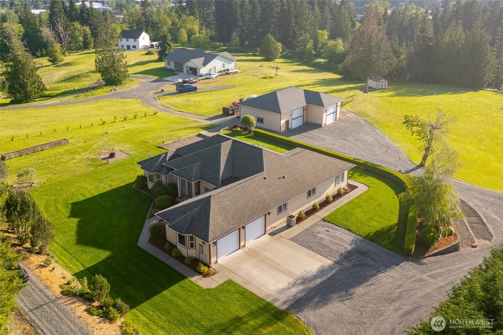Welcome to this exceptional 5.3+/- acre estate featuring a custom-built, one-owner home with sweeping views of the Willapa Hills. Thoughtfully landscaped and filled with natural light, this split-bedroom floor plan offers stunning indoor and outdoor living spaces designed to capture unforgettable sunsets and panoramic territorial views. The expansive west-facing deck and backyard provide the perfect setting for entertaining or relaxing year-round. Spacious primary suite includes a large ensuite bath, creating a peaceful private retreat. Property also features a 2-car garage, RV hookup, and an impressive 1,776+/- sq. ft. heated and fully finished shop with its own bathroom — ideal for hobbies, storage, projects, or home business potential. A rare opportunity combining scenic beauty, comfort, and functionality just minutes from town!