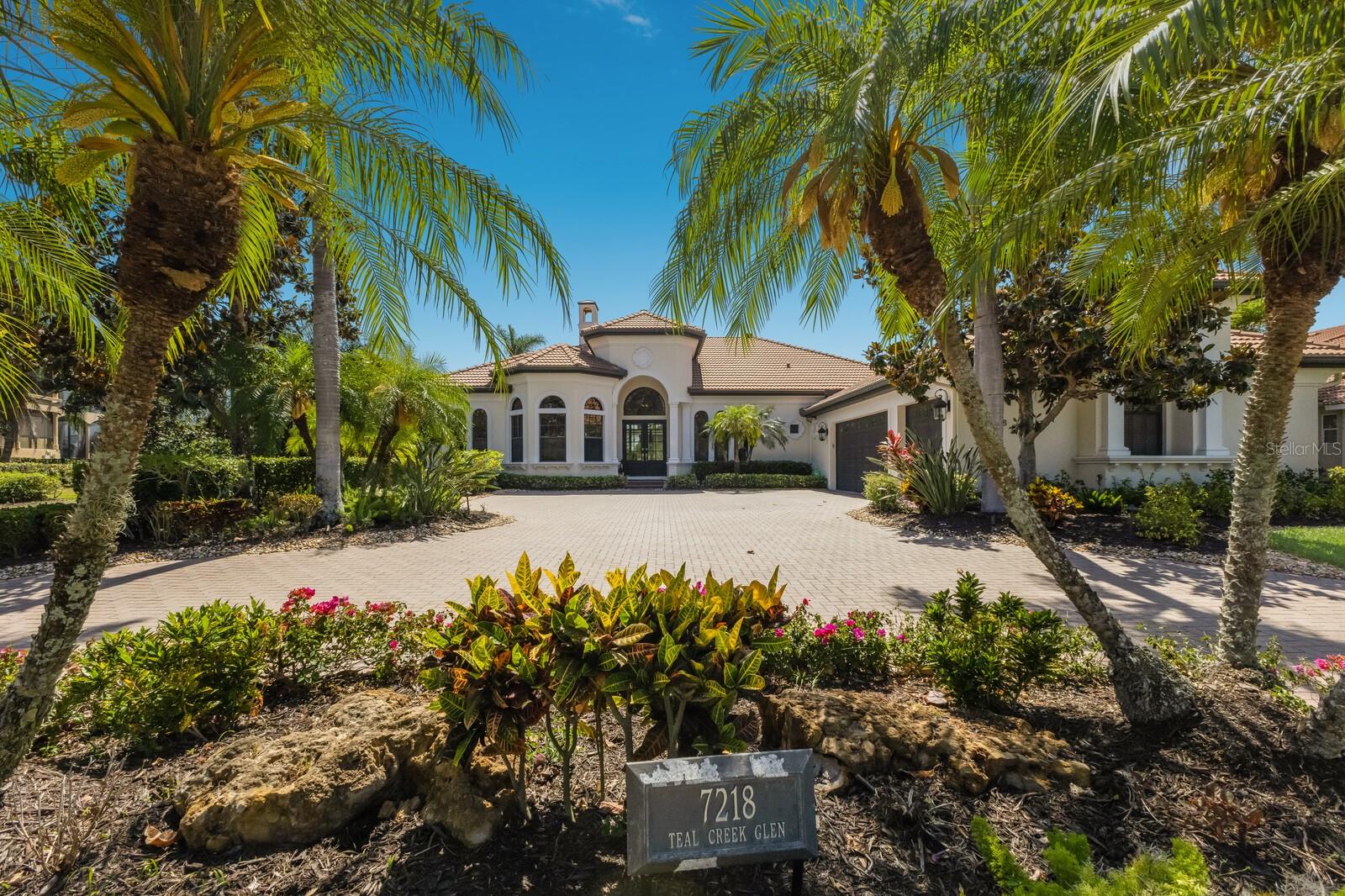 Under contract-accepting backup offers. Experience the pinnacle of refined living in this exquisitely renovated 4,200 square foot home, perfectly situated in the exclusive Teal Creek enclave of Lakewood Ranch Country Club. Set on an expansive half-acre lot, the property enjoys a coveted west-facing orientation, offering sweeping panoramic views of the meticulously maintained golf course and a tranquil lake. This distinguished residence is a harmonious blend of classic sophistication and modern luxury, providing an ideal sanctuary for both relaxed family life and elegant entertaining.
Upon entering, you are welcomed into a thoughtfully designed open floor plan that effortlessly flows from space to space. With four generously sized bedrooms, three and a half beautifully appointed bathrooms, and a dedicated home office, the residence is as functional as it is stylish. At the heart of the home lies a breathtaking gourmet kitchen that would inspire any culinary enthusiast. Outfitted with sleek quartzite countertops, custom cabinetry, and premium Wolf and Sub-Zero appliances, this chef’s haven is as practical as it is visually striking.Throughout the four bedroom home, meticulous attention to detail is evident in every finish. Enjoy friends and family in chef's kitchen with quartzite counters, spacious island seating and ice maker!  Retreat to the Bonus room with wet bar and exoctic grantie counters.  The bonus room offers spectacular views of the sunset skies and may be converted to a fifth bedroom with the existing closet! already in place.  Engineered hardwood flooring and large-format porcelain tile lend warmth and elegance, while expansive sliding glass doors frame the picturesque outdoor scenery and invite natural light to pour in. The primary suite serves as a peaceful retreat, offering serene views, a spa-like bathroom, and two generous walk-in closets that provide ample storage and organization.Outdoor living reaches a new level of luxury with a private resort-style oasis that awaits just beyond the glass doors. A beautifully resurfaced pool surrounded by marble pavers, a spa, and a sun shelf create a relaxing and stylish atmosphere, all enclosed by new clear view screens to ensure uninterrupted vistas. An outdoor kitchen and spacious dining area make alfresco entertaining effortless, all set against the stunning backdrop of lush fairways and shimmering lake waters. For pet lovers, the large fenced-in yard provides a safe and spacious area for furry companions to roam freely. Adding yet another layer of comfort and charm, the south side yard features a cozy firepit seating area, perfect for enjoying cool Florida evenings under the stars. This remarkable home is more than just a residence—it’s an opportunity to embrace an upscale Florida lifestyle in one of Lakewood Ranch’s most desirable communities. This home also offers impact glass Sliding doors, impact front door, a Generac Generator that powers the entire home and a water filtration system! Enjoy extremely low HOA fees, this property offers stress-free, high-end living. Rarely does a home of this caliber become available, and with its prime location, thoughtful updates, and unmatched setting, this four-bedroom gem won’t remain on the market for long. Don’t miss your chance to make it yours