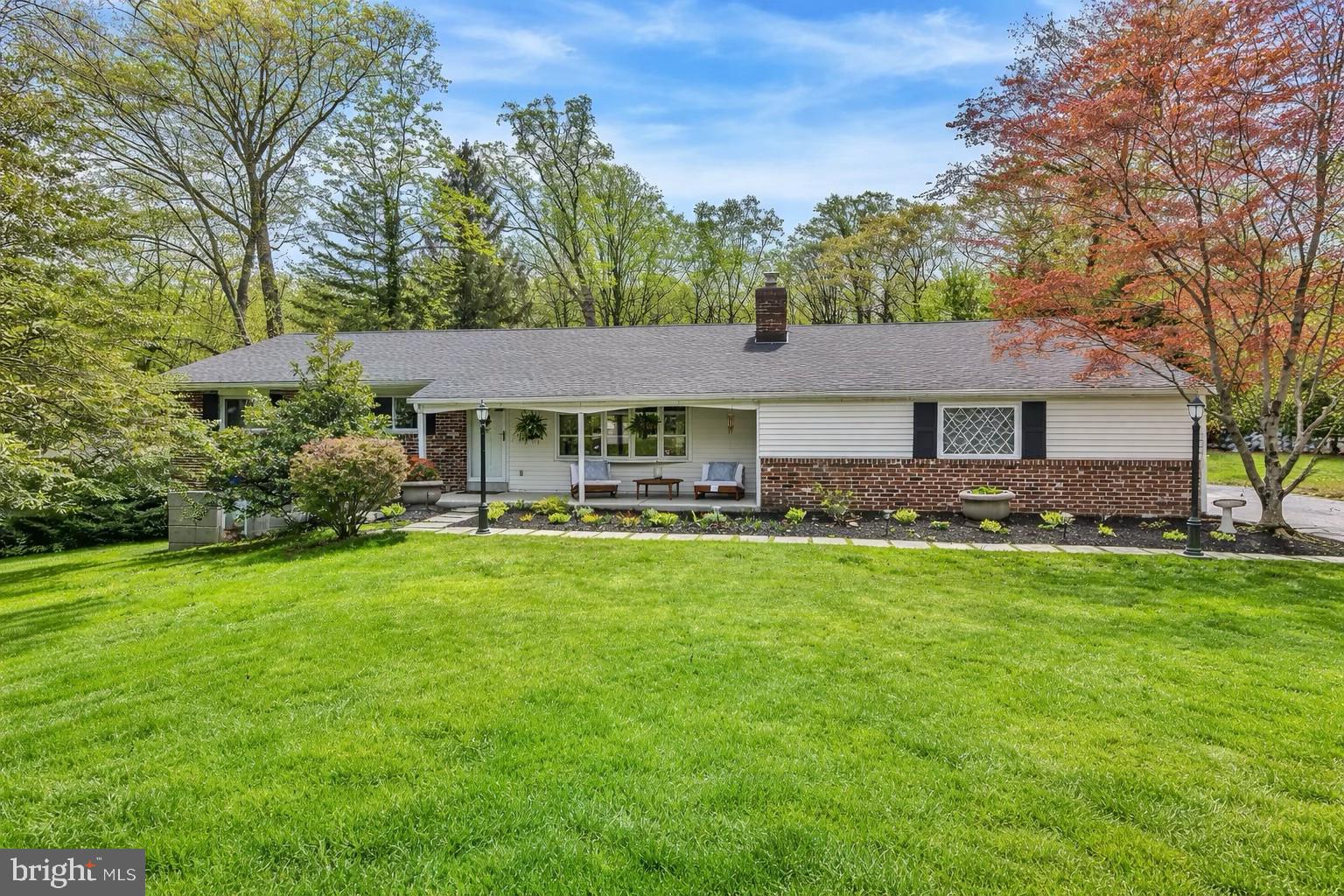This brick ranch home sits on a picturesque corner lot in a quiet, established, storybook neighborhood in Rose Tree Media School District. The paver walkway leads you to the charming covered front porch. Inside, the home opens into a spacious living room filled with natural light, featuring custom built-in bookcases and a classic fireplace that gives the space warmth and character from the start.From there, the layout flows into a formal dining room, framed by peaceful views of the private backyard. Just off the dining room, the updated kitchen offers granite countertops, stainless steel appliances, and an abundance of cabinetry designed for everyday function with an easy connection to the rest of the home. A cozy den sits just beyond, anchored by a wood-burning fireplace that makes it the perfect spot to unwind.Down the hall, you’ll find two nicely sized bedrooms along with a serene primary suite featuring a full bath and tranquil backyard views. The lower level expands the living space even further, offering flexibility for a playroom, home office, gym, or media space, along with a dedicated laundry area and ample storage. Out back, the fully fenced yard is beautifully maintained and offers private, peaceful outdoor retreat. A two-car garage adds everyday convenience and ample storage.This home is located in the highly sought-after Rose Tree Media School District, with easy access to local favorites including Linvilla Orchards, Ridley Creek State Park, Tyler Arboretum, Indian Orchards, and the Chester Creek Trail. At the end of the cul-de-sac, the Middletown Township Trail offers immediate access to walking and nature right from your doorstep. With quick connections to Routes 352, 252, Route 1, I-476, and the Elwyn Train Station, commuting to Center City Philadelphia, the airport, and stadiums is simple and convenient.Interior photos available 4/21.