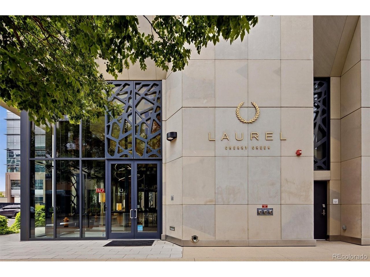 A rare opportunity at The Laurel, Cherry Creek North's premier full-service residential address. Residence #319 is an exceptional 1,697-square-foot corner residence where refined interiors, extraordinary views and effortless service create a distinctive Colorado lifestyle.Privately positioned on the coveted south and east sides of the building, this sophisticated two-bedroom, three-bath home is filled with natural light and captures expansive views of Cherry Creek and the Rocky Mountains. The thoughtfully designed floor plan offers elegant spaces for entertaining and intimate retreats.The beautifully appointed chef's kitchen features premium appliances, custom cabinetry, quartz surfaces and an expansive island. Living and dining spaces are anchored by a rare gas fireplace and open through oversized glass doors to an expansive south-facing terrace-ideal for entertaining, unwinding and savoring Colorado sunsets.The serene primary suite features expansive windows, generous walk-in closets and a spa-inspired bath with dual vanities, quartz counters, oversized walk-in shower and newly added closet. A spacious guest suite with custom closet and en-suite bath offers a private retreat. A versatile flex space can serve as an office, den or dining room.The Laurel offers exceptional service and amenities, including a full-time attended front desk until 10 p.m. and spectacular rooftop retreat with heated year-round pool, cabanas, fire features and outdoor kitchen with pizza oven, grills and refrigerator, all overlooking panoramic city and mountain vistas.Four deeded heated-garage spaces, EV charger and private storage complete this rare offering. Steps from Cherry Creek North's celebrated restaurants, luxury boutiques and galleries, Residence #319 offers sophisticated lock-and-leave living.