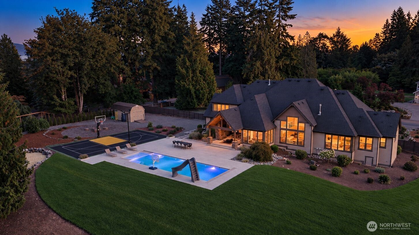 Set behind the gates of an intimate three-home community on more than two acres, this 4,440-square-foot residence offers something increasingly rare: Space to breathe, complete privacy, and a setting designed to truly enjoy being home. Surrounded by evergreen trees and peaceful landscaping, the property feels tucked away from the moment you arrive. Built by Sierra Homes, an independent builder known for individually crafted residences and meticulous attention to detail, the home features a beautifully open floor plan, high ceilings, where expansive living spaces come together naturally. Thoughtfully refreshed in 2023 and beautifully maintained, every space feels equally suited for comfortable everyday living and memorable gatherings with friends. A custom 30-foot heated pool with an automatic cover and non-slip porcelain surround creates the feeling of a private resort just steps from home. Spend sunny afternoons by the pool, gather friends for basketball or pickleball on the custom sport court, or enjoy the in-ground trampoline - all surrounded by the privacy of more than two acres of fully fenced grounds. It is a home built for entertaining, but equally special on the quiet days: morning coffee surrounded by trees, afternoons by the pool, and evenings spent outside with friends. Gated acreage, exceptional privacy, resort-style amenities, and a beautifully maintained custom home - an increasingly rare combination!
