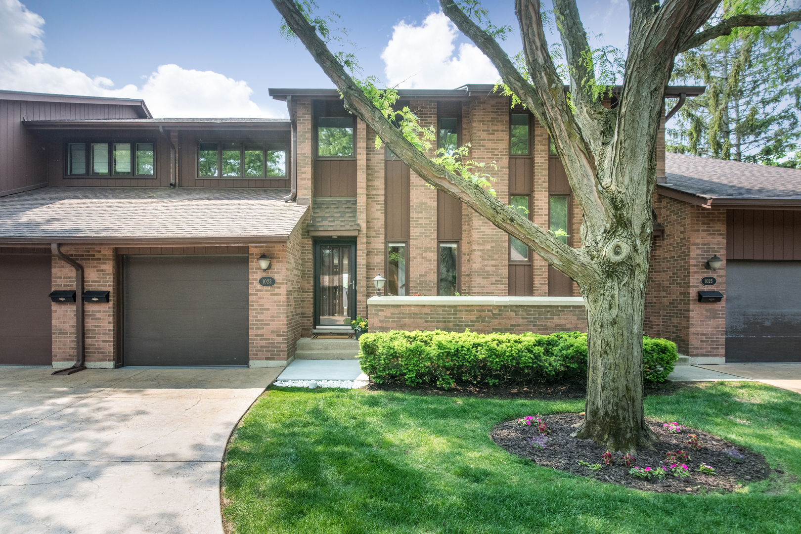 This lovely townhome has been meticulously maintained. First floor boasts hardwood floors, oak six panelled doors, crown moulding, recessed lighting, decorative fireplace, updated kitchen with granite countertops and stainless steel appliances. Lovely dining room overlooking patio and gardens. The second floor has an expanded loft area perfect for a home office. Spacious primary bedroom has large walk-in closet. 2nd bedroom with two double closets. All doors on second floor are six paneled poplar doors, Basement with high ceilings is perfect for storage or ready to be finished. Laundry room, newer mechanicals include furnace, A/C, water tank 2019, new sump pump 2024, new sewer line 2023, new patio 2020, roof 2017. The home is located on a peaceful, tranquil, tree-lined street.  Absolutely move-in ready!