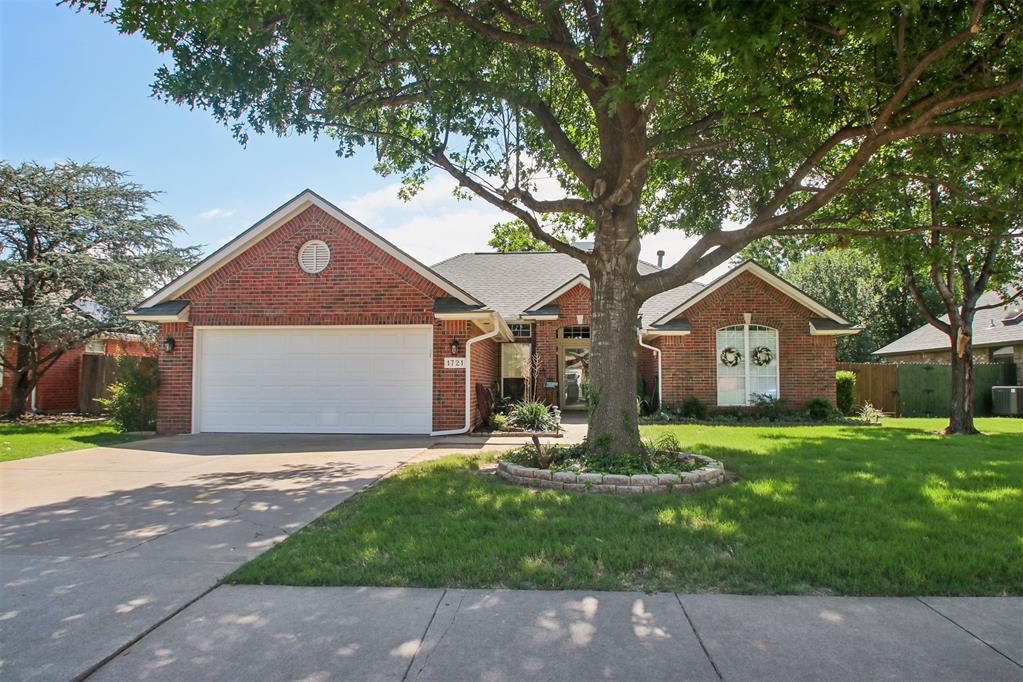 Welcome home to one of Norman's most thoughtfully updated properties nestled in the heart of core Norman, minutes from the University of Oklahoma, Campus Corner, I-35. Location this central with a home this renovated is a rare find.The 2021 roof gives buyers instant peace of mind, select updated windows improve efficiency, and added insulation throughout the home translates directly into lower utility bills month after month. This home was not just refreshed cosmetically. It was improved where it counts. Step through the front door and the living room opens up in front of you in a way that immediately impresses. Vaulted ceilings, wood look tile throughout, a brick fireplace flanked by rich wood columns and trim work, and detail along the walls give this space a warmth and character that new construction simply cannot replicate. To the left of the entry is the formal dining space, and just behind the main living area sits a secondary dining flex space currently used as an office. The kitchen holds its own with updated subway tile backsplash, bright task lighting, a Bosch dishwasher, and a walk in pantry loaded with shelving and storage. Quartz countertops finish the space! Matching quartz carries through into the bathrooms as well. The laundry room includes cabinetry above the washer and dryer for that extra storage that always gets noticed. The primary bathroom is fully updated with a separate shower, a jacuzzi tub, and stunning turquoise tile in both the shower and tub! Double sinks and a large walk in closet with built in shoe shelving complete a primary suite that feels like a daily retreat. Out back, an extended patio with a dedicated sitting area and an exterior door that makes grilling a breeze is ready for entertaining. A fenced dog run keeps your four legged family members happy and contained, and mature trees frame the yard beautifully with the kind of shade and established character that only time can provide.
