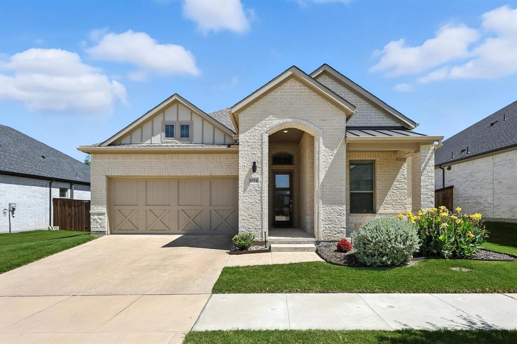 Welcome to this premier 55+ active adult lifestyle community!  HOA includes front yard maintenance!!!  Visit the community center with fitness center, pool, pickleball, fire pits and community events so you can feel right at home. This open concept Trophy Signature home has every detail in mind for discerning buyers, including 12-foot vaulted ceilings throughout.  The beautiful kitchen features a huge Quartz island with built in wine rack, and wine or beverage refrigerator; double ovens; large walk-in pantry, stainless appliances with gas cooktop and beautiful dining area overlooking the patio with built-in barbecue grill.  Lovely hardwoods throughout common areas.  Beautiful carpet in bedrooms and stunning ceramic tile in the baths.  Both baths have showers and lots of storage. Living room features an electric fireplace and flat screen wiring.  This home is energy efficient with foam insulation, tankless water heater, home automation package with video doorbell and energy efficient windows and appliances. The location is amazing – so close to shopping and conveniences provided by easy access to both US 75 and SH 121.
