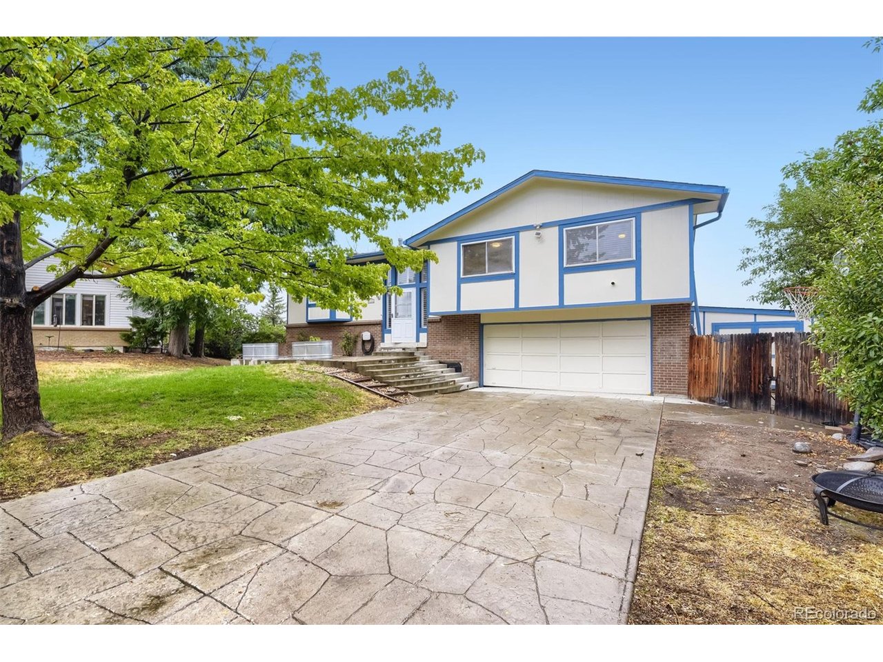 COMING SOON. SHOWINGS WILL COMMENCE AFTER TUESDAY AUGUST 18TH! Welcome to 7533 W Ottawa Place, a beautifully updated 4-bedroom, 3-bathroom home in Littleton's desirable Columbine West neighborhood. Offering an inviting open floor plan, stylish updates, incredible outdoor living, and unobstructed mountain and city views, this home is ready to impress. Home offers over 2000 finished square footage for your living experience.Step inside to a bright, open living and dining area designed for both everyday living and entertaining. The updated kitchen features granite countertops and a comfortable eat-in dining area, creating a welcoming space for morning coffee, family meals, and gatherings with friends.One of the true highlights is the huge deck, where you can relax and take in sweeping, unobstructed mountain and city views. Unwind in your private Jacuzzi, entertain on warm Colorado evenings, or simply sit back and enjoy the scenery. The backyard has been completely xeriscaped with turf and mature trees, offering an attractive outdoor retreat without the constant upkeep-a perfect combination of beauty and low-maintenance living.  The oversized garage has exterior entrance and also entrance into the house.Upstairs, laminate flooring runs throughout, while the spacious primary bedroom features a walk-in closet and private 3/4 bath. The home also features beautifully updated bathrooms and new carpet, giving the interior a fresh, move-in-ready feel.Major improvements add even more peace of mind, including a new roof and new HVAC system. Even better, the neighborhood HOA is voluntary at only $35 per month.Enjoy a fantastic Littleton location with convenient access to shopping, Downtown Littleton, hiking and the foothills, plus iconic Red Rocks Park & Amphitheatre.Updated, low-maintenance, and showcasing incredible Colorado views this home is move in ready! For private showings and special financing contact the listing agent directly.