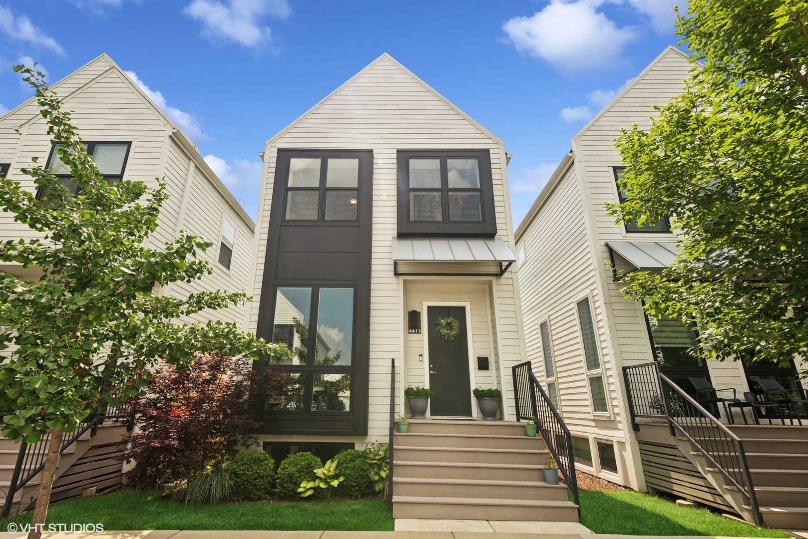 Located in the award-winning Basecamp development, this contemporary 4 bed/3.5 bath single family home is centrally located in Old Irving Park. Built in 2018, this home offers a sophisticated blend of modern design and a thoughtful layout spread across three levels.  Step inside to an open concept main level with hardwood floors throughout, highlighting a chef's kitchen, complete with custom Italian cabinetry with a pantry, oversized island, stainless steel appliances, and quartz countertops.  The luxurious kitchen flows seamlessly into the dining and living areas, perfect for hosting and entertaining.  There is also a powder room on the main level for added convenience.  The top level features vaulted ceilings, hardwood floors throughout, laundry on the bedroom level, and a desirable 3 bed / 2 bath layout. The primary suite features a king sized bedroom, walk-in closet, and an ensuite bathroom with dual vanity sink and walk in shower.  The full basement hosts a family room, a 4th bedroom, and a full bathroom, ideal for guests or a home office.  Finally, savor the tranquility of your private backyard, complemented by a patio, and a 2-car detached garage. Conveniently located with easy access to the highway, Grayland Metra, Irving Park Metra, Irving Park CTA, and multiple bus lines, The Basecamp community features a centrally located private park with a playground, ideal for summer months. This particular home is uniquely positioned on quiet, residential Waveland Avenue-one of the few in Basecamp that neither fronts Milwaukee Avenue nor backs up to the Metra tracks.  Experience the charm of contemporary living in a vibrant community, ready to welcome you home!
