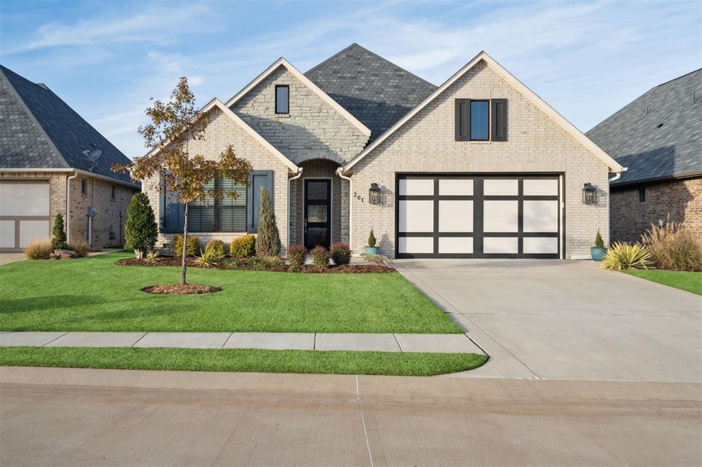 Located in a beautiful gated community with a pool and fitness center, this stunning home offers both comfort and style. Off the entry, you’ll immediately notice the beautiful wood flooring that flows throughout the main living areas and the primary bedroom, setting a warm and elegant tone.
The kitchen features quartz countertops, stainless steel appliances, a walk-in pantry, and barstool seating—perfect for everyday living or entertaining guests. The primary suite, privately situated at the back of the home, offers a relaxing retreat with a spa-like bathroom featuring a double vanity with large mirrors and a spacious walk-in closet that conveniently connects to the laundry room.
The split floor plan places both secondary bedrooms toward the front of the home with a shared full bath, plus a half bath just off the main living area for guests. Additional highlights include custom remote-controlled shades, a storm shelter, and an irrigation system on a private well that is owned and maintained by HOA! The lawn maintenance is also taken care of by the HOA.
Step outside to a large backyard perfect for entertaining, complete with a built-in grill and a covered patio featuring Phantom screens—ideal for enjoying outdoor living in comfort year-round.