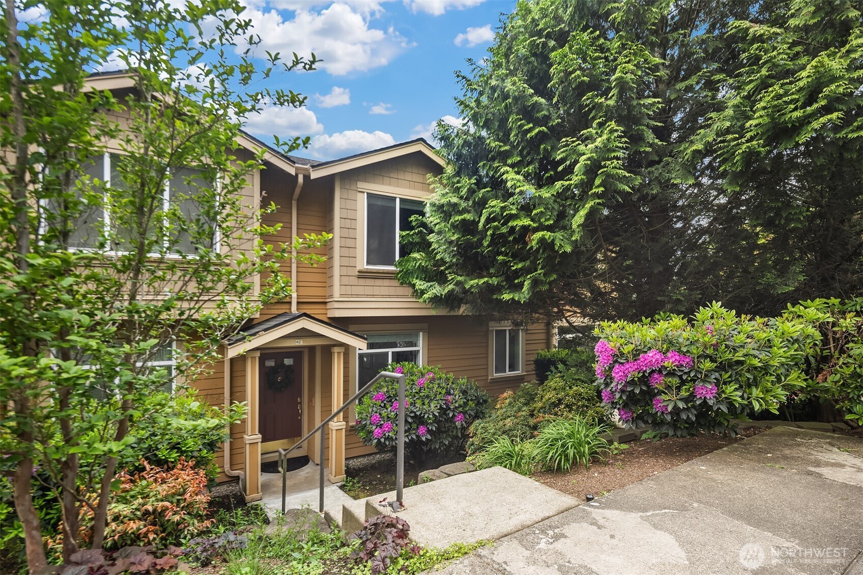 Sitting high over Issaquah, this South-facing townhouse boasts ample natural light and Poo Poo Point views. The welcoming entrance leads you into an open main floor including updated kitchen with corian counters, pantry, and clear view across the dining space into the living room boasting built-ins, gas fireplace, engineered hardwood floors, UV roller shade, and easy access to a bright deck. Upstairs are 2 bedrooms and 1.75 baths highlighted by the primary suite w/double closets and a Squak Mountain panorama. Downstairs is the 2-car garage that is great for parking and extra storage. Easy access to Issaquah’s amenities, Duthie Hill, Snoqualmie Pass, I-405 and much more are huge bonuses.