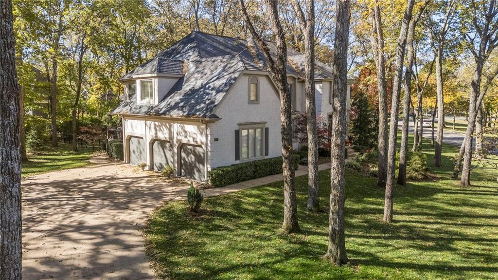 Welcome to your dream home in the Loch Lloyd! Thisgorgeous residence is situated on one of the most beautifultreed lots,  a 1-minute walk to the clubhouse, pool, & golfcourse. You'll be captivated by the sweepingstaircase that sets the tone for updated elegance throughout.Most everything in this home is NEW or recentlyupdated! Notice quality hardwood floors, exquisitely detailedwoodwork trim, & plantation shutters throughout. Thecountertops in the kitchen complement the oversized island andtop-of-the-line stainless steel appliances, making it a chefsparadise. Enjoy views from the kitchen that overlook the Treksdeck and a HUGE .53 acre yard, perfect for entertaining andfamily fun. Relax around the cozy fire pit surrounded by lushtrees and manicured green space. This home offers peace and tranquility well away fromfuture construction, while still being just steps away from theclubhouse and amenities. The fully renovated (2024) LL features a walk-out design w/plenty of naturaldaylight, a bar, fireplace, theater area, 1/2 BA &hobby room, ideal for relaxation and entertainment.Upstairs, discover 4 spacious bedrooms, including a wonderfulprimary suite that boasts an adjacent hearth room, heatedfloors in the luxurious primary bath, a HUGE walk-in shower &a large jacuzzi tub for ultimate relaxation. A secondary backstairway makes for convenient quick access to the kitchen,laundry area, and the three-car garage, equipped with GarageTek walls and spacious built-in utility cabinets. This home trulyhas it all, and the ‘extras’ just add to its charm, such as fourcozy fireplaces, 3 beverage refrigerators, and a breezy attic fan.The new fitness center is just a short walk and offers indoor andoutdoor tennis and pickle ball courts. Don’t forget the nearbynamesake lake offers fishing, boating, and water fun. Don’t missyour chance to own this stunning property and enjoy the LochLloyd lifestyle. Schedule your showing today!