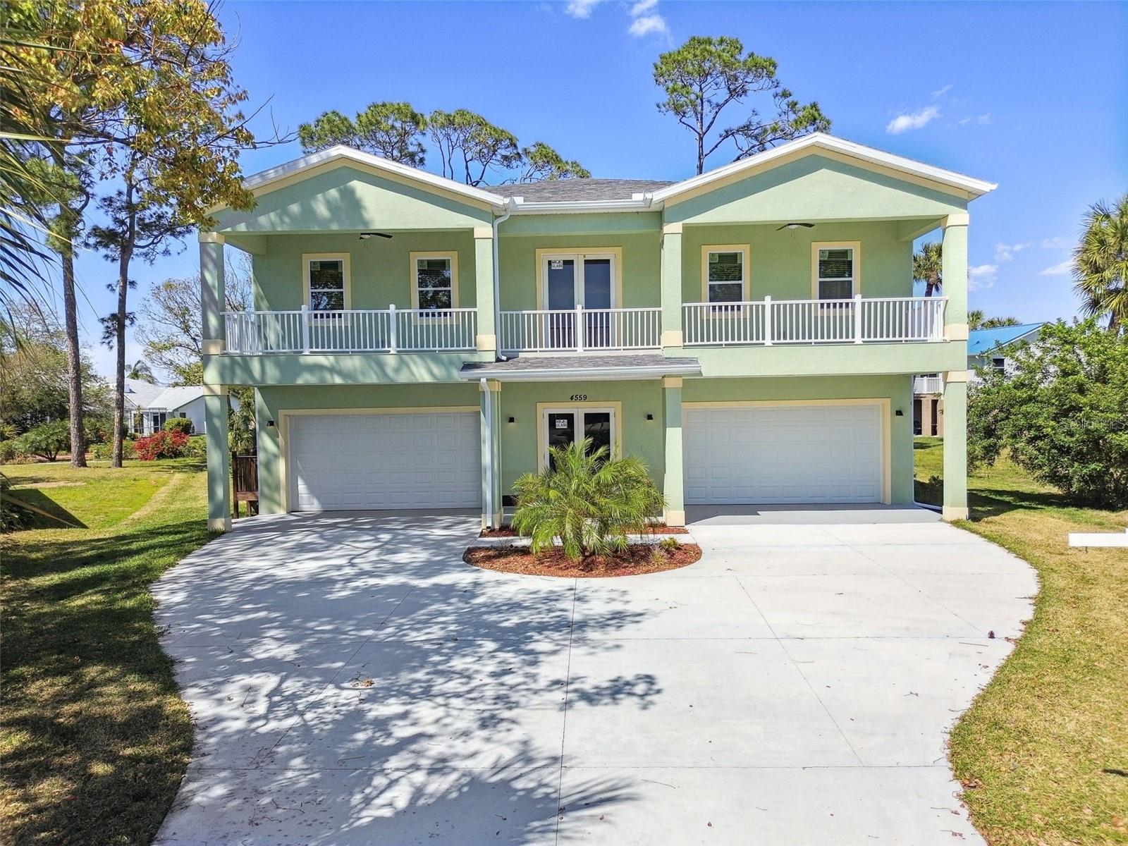 One or more photo(s) has been virtually staged. NEW CONSTRUCTION single family elevated home in desirable Gulf Harbors built to the latest hurricane standards. This new construction raised home boasts of 2137 square feet featuring a grand open concept living/dining area, modern and sleek kitchen, 4 spacious bedrooms, 2.5 luxurious baths, 4 car garage, pool with paver decking and screened enclosure and large covered lanai with ceiling fans and more! You'll be wowed by this home and it's upgraded, stylish finishes. The oversized living room area with tray ceiling offers can easily fit the entire family with additional room for friends and guests. The chef of the family will fall in love with the kitchen featuring quartz countertops providing plenty of room for meal prep and stainless steel appliances make cooking a breeze. Modern, sleek light cabinets provide bountiful storage. The center island provides both storage and an additional seating area creating the perfect spot for morning coffee and breakfasts. The dining area provides room for the entire family to enjoy meals together. The kitchen and primary bedroom each feature a door leading out a balcony where you can view the large enclosed swimming pool area below. The front of the home features an additional balcony with tiled flooring and ceiling fans providing the opportunity to relax and enjoy the Florida sunshine. The grand 4 car garage finished with beautiful epoxy features plenty of parking and also provides extra storage space. Walking out to the covered lanai and screened pool area you'll be stunned at the size and space where you can create your own outdoor oasis with plenty of room for a dining area, living area and space to install an outdoor kitchen. An added benefit of this great home is the option to become a member of the Gulf Harbors Beach Club which offers covered pavilions, picnic tables, grills, bathrooms and more for enjoying day in the sun. Membership is an additional $200 a year. Don’t let this one get away. Schedule your own private showing today! (Please note some photos have been virtually staged)