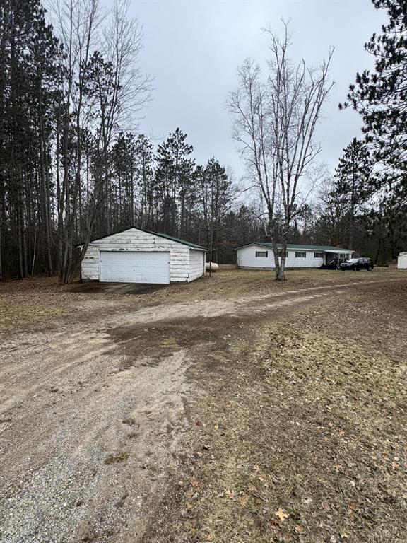 Discover this rare 19.1-acre property located just off M-115. Featuring a 3-bedroom, 2-bath home, the residence offers a spacious layout; a large living room, formal dining area, & a walk-in primary suite. Recent updates include electrical improvements, a newer furnace & some updated windows, providing a solid foundation for your finishing touches.Step outside, take in the scenic views of rolling, buildable land, complete with small wetland area adding natural character & privacy. Nearly an acre is already cleared for the existing home, while the remaining acreage presents endless possibilities.Whether you're looking to update the current home into your ideal residence or explore development potential by splitting the land into multiple parcels, this property offers incredible flexibility. Conveniently located minutes from the Buckhorn Saloon, you'll enjoy both seclusion and accessibility.An opportunity for homeowners, investors or developers alike. *Agent is related to seller*