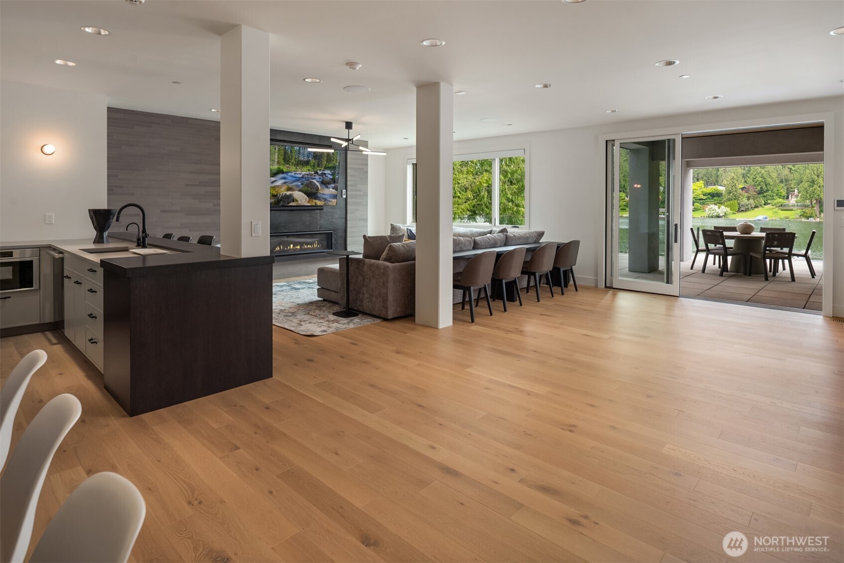 The lower level features a rec room/bar, gym & sauna.