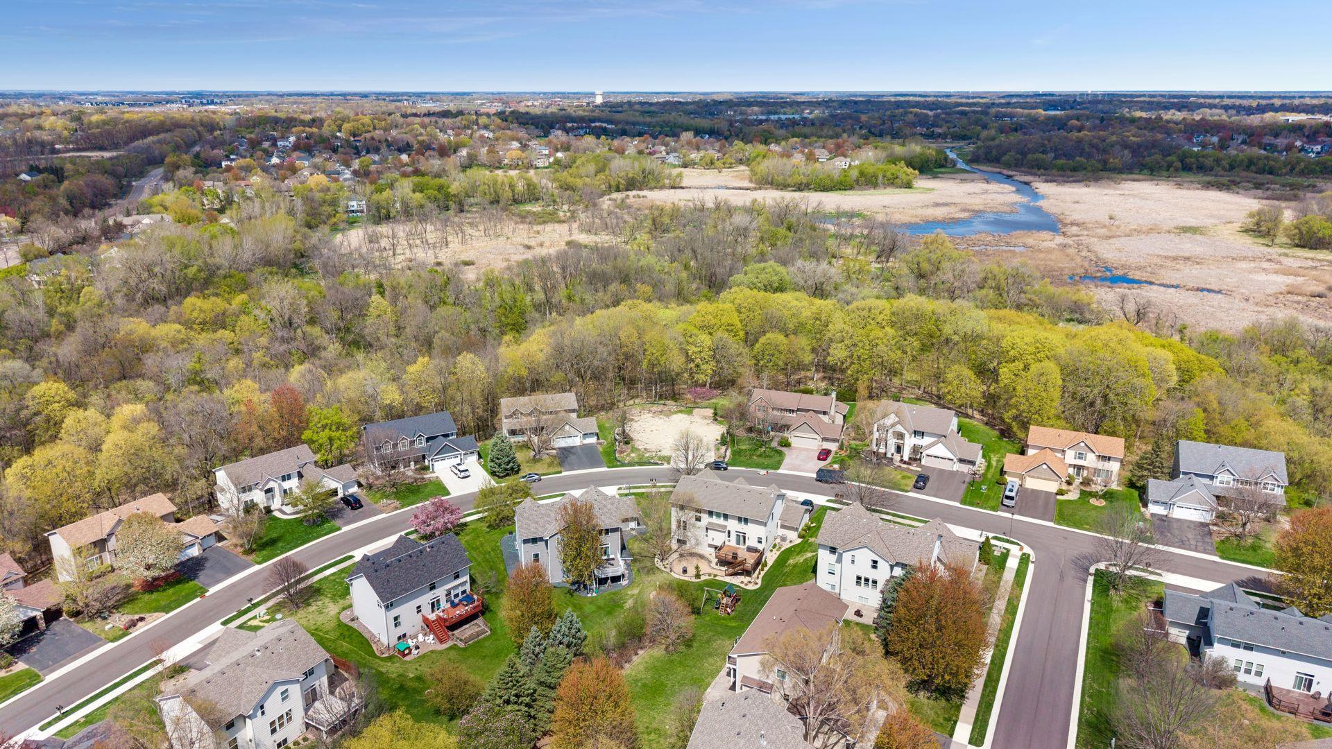 Opportunity awaits in Nottingham! Build your dream home nestled in the established high-demand Nottingham community with two neighborhood parks, two pools, basketball court, and Three Rivers trail system. Just down the hill from this beautiful lot is Medicine Lake Regional Trail, a 20.7-mile paved bicycle and walking path that directly connects Elm Creek Park Reserve, Rice Lake and Fish Lake Regional Park where tranquil scenery, beautiful landscaping, and abundant wildlife create a peaceful retreat right in your backyard. Amazing tree line with privacy galore, backing to a nature preserve and Elm Creek off in the distance - making this one of the most sought-after lots when the community was developed. The lot is currently a lookout and could possibly accommodate a walkout, depending upon your builder's assessment. Located within the award-winning Osseo school district, with additional nearby charter and private school options, this prime location is just minutes from Rush Creek Golf Course, premier shopping, dining, and the Maple Grove Community Center. Open builder possibilities with this sought-after lot; there are no builder restrictions. Your dream home awaits!