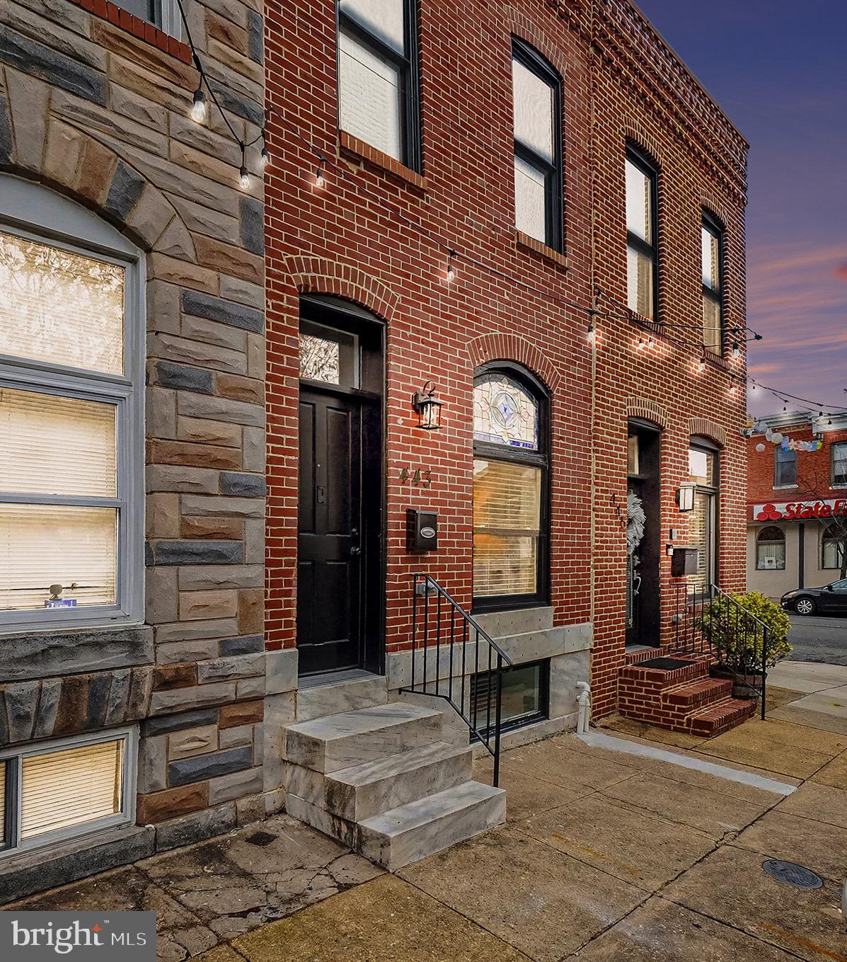 Experience Luxury in Patterson Park! Welcome to this meticulously crafted renovation on one of the neighborhood's most coveted blocks. This expansive 4-bedroom, 3.5-bathroom home blends historic charm with modern sophistication, featuring shimmering hardwoods, exposed brick, and soaring ceilings. The chef’s kitchen is a showstopper, boasting custom cabinetry, quartz countertops, and a high-end stainless appliance package. Retreat to the primary suite with its oversized closet and spa-inspired shower, or host guests on the massive rooftop deck featuring panoramic views. Complete with a finished lower level, two additional bedrooms or recreational space, ample storage, and an option for a private fenced yard or off-street parking pad, this home offers rare convenience. Benefit from the 10-year CHAP tax credit while living steps from the park and local favorites!