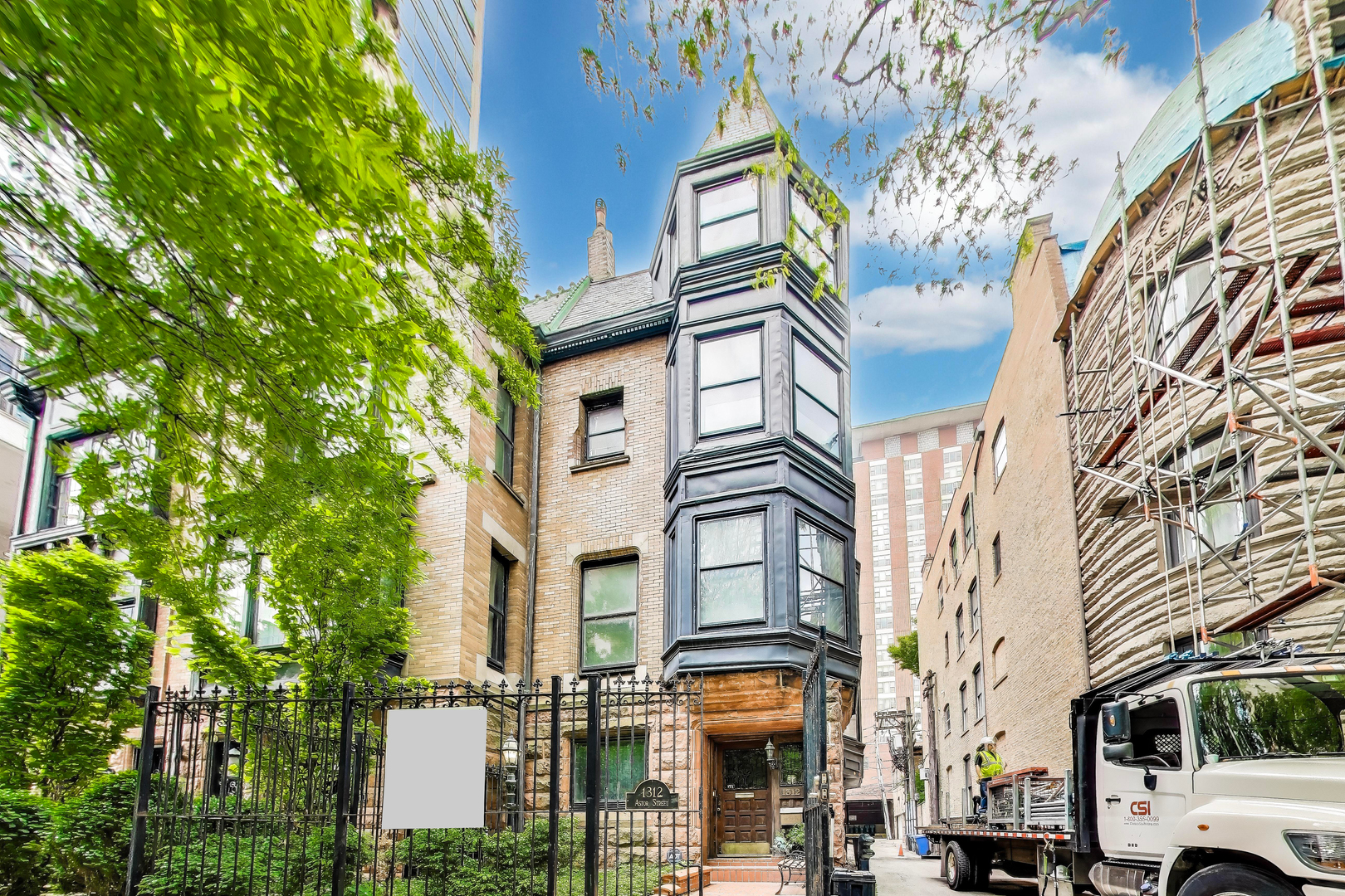 Rare Historic Gem on Prestigious Astor Street. Step into a piece of Chicago's architectural legacy with this remarkable corner rowhome, designed in 1887 by the iconic firm Burnham & Root. Originally one of four distinguished residences showcasing the bold elegance of the Richardsonian Romanesque style, this home sits next to 1310 N. Astor-once the personal residence of John Wellborn Root, a founding figure of the Chicago School architecture style. Offering a rare opportunity to restore and reimagine, this property invites you to create a one-of-a-kind modern residence within an irreplaceable historic shell. Situated on a corner, sunlight pours into the home from its north, east, and west exposures through oversized windows, illuminating four expansive levels with soaring 10-foot ceilings and exquisite original millwork, including a dramatic grand staircase. Features include: Attached 1.75-car garage; 6 fireplaces; Full, Potential for 2 private outdoor terraces on separate levels; Elevator access to multiple floors; full and dry basement. Currently configured with 5 bedrooms and 4 bathrooms in a space with limitless layout possibilities. Essential updates have already been completed, including a new roof, HVAC system, and extensive masonry work-paving the way for your custom vision.