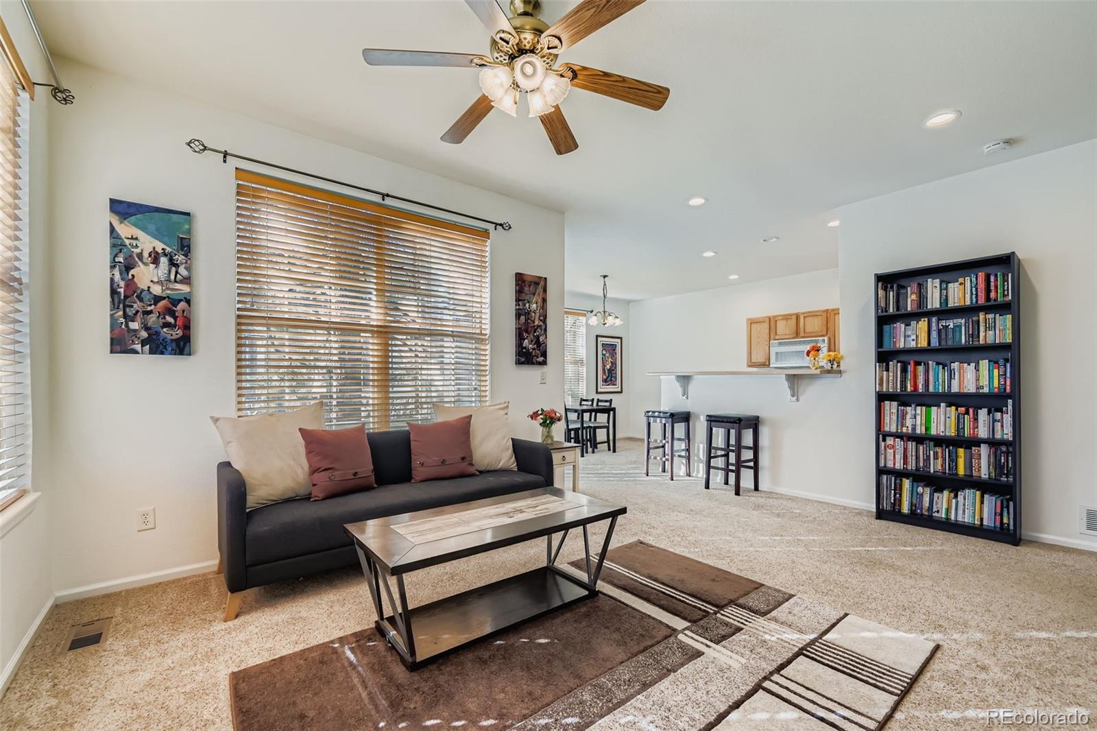 Spacious, light-filled, and thoughtfully designed, this two-story townhome with full basement offers the perfect blend of comfort, and low-maintenance living in one of Lafayette's most desirable communities. Soaring ceilings, oversized windows, and an open-concept floor plan create an inviting space that's ideal for both everyday living and entertaining indoors and out on your spacious private deck. The kitchen features abundant cabinetry, breakfast bar seating, and a seamless flow into the dining and living room areas. City of Lafayette maintained Whitetail Park is immediately adjacent to the community, featuring paved walking trails, tennis courts, playgrounds, covered picnic and recreation areas, and much more. Bike & hiking trails honeycomb the entire area and are connected to everything!The versatile main level includes a generously sized bedroom & full bath, ideal for guests or home office. Upstairs, the private primary suite boasts vaulted ceilings, abundant natural light, and a spacious five-piece bath, dual vanities, a soaking tub, walk-in shower, and ample storage. The full unfinished basement with two egress windows offers endless potential, whether you envision additional living space, a home gym, or extra bedrooms.Enjoy the convenience of an attached garage, private outdoor space, and beautifully maintained community grounds featuring mature landscaping, and a private community pool. The HOA covers exterior structure maintenance, lawncare, snow removal, water, sewer, trash, and more, making homeownership even easier.This peaceful neighborhood setting is super convenient to DIA, E-470, Boulder Turnpike, Eldora, just minutes to Old Town Louisville or Downtown Lafayette, Boulder, Broomfield, Longmont and less than an hour from Rocky Mountain National Park. Truly great access to all the restaurants, shopping, coffee shops and outdoor Colorado living that Denver & Boulder County have to offer!!