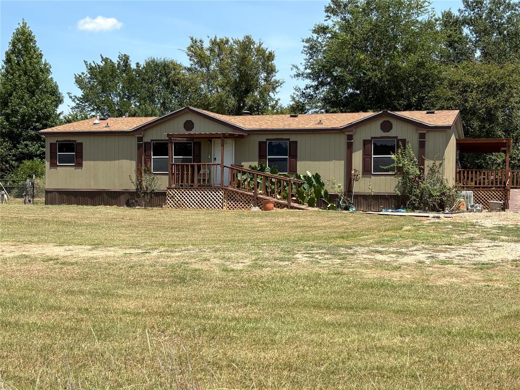 Well maintained 3 Bedroom 2 Bath home on over 2.3 scenic acres. Located only 15 minutes south of Sulphur Springs in the Reilly Springs community and SSISD. This home offers open concept large living area with beautiful flooring, fireplace and ceiling fans. The kitchen features tremendous counter space, island and beautiful wood cabinets with a dining area that opens up to a large deck. The master has large bath with walk in closet, double sinks and jetted tub. Split bedrooms.  Also, a large utility-mud room has its own entrance with room for storage or freezer. All three entrances have porch with ramps. Enjoy the peaceful setting on the large back wrap around porch overlooking a small pond and small amount of trees behind the home. As a bonus is a covered carport with work or storage area. Located back off the road enough to offer some privacy and still have enough room for a few small animals or a garden in the fine sandy freestone soil. There is additional acreage for sale by neighbor if you need more land.