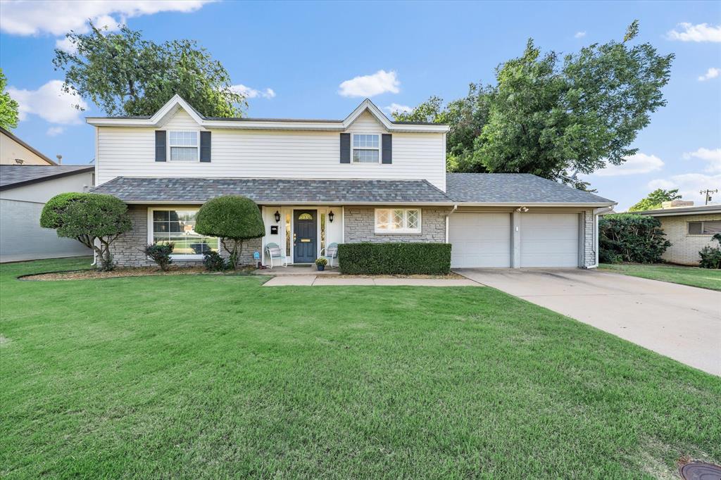6801 N Shawnee Avenue has the space and updates you’ve been looking for! Step inside to beautiful hardwood floors and an open living and dining area perfect for entertaining. The formal dining room opens directly to the backyard, making it easy to host summer cookouts or enjoy weekend brunch outdoors. The updated kitchen features a farmhouse sink, Bosch dishwasher, range, microwave, pantry, and refrigerator that stays. Enjoy casual mornings at the eat-at bar or breakfast room, then relax in the second living room with a cozy fireplace.
All four bedrooms are upstairs, each with a walk-in closet. The primary suite offers a large walk-in closet and a spa-like walk-in shower. A half bath is conveniently located downstairs, along with an inside laundry room loaded with storage and a two-car garage with openers.  The large backyard is built for gathering — grill out with friends, watch kids or pets play, or soak in the negotiable hot tub under the stars. Blinds on all windows, a new electrical service, and excellent storage throughout make this home truly move-in ready!  Check out all the updates on the Property Information sheet attached.  Welcome home!