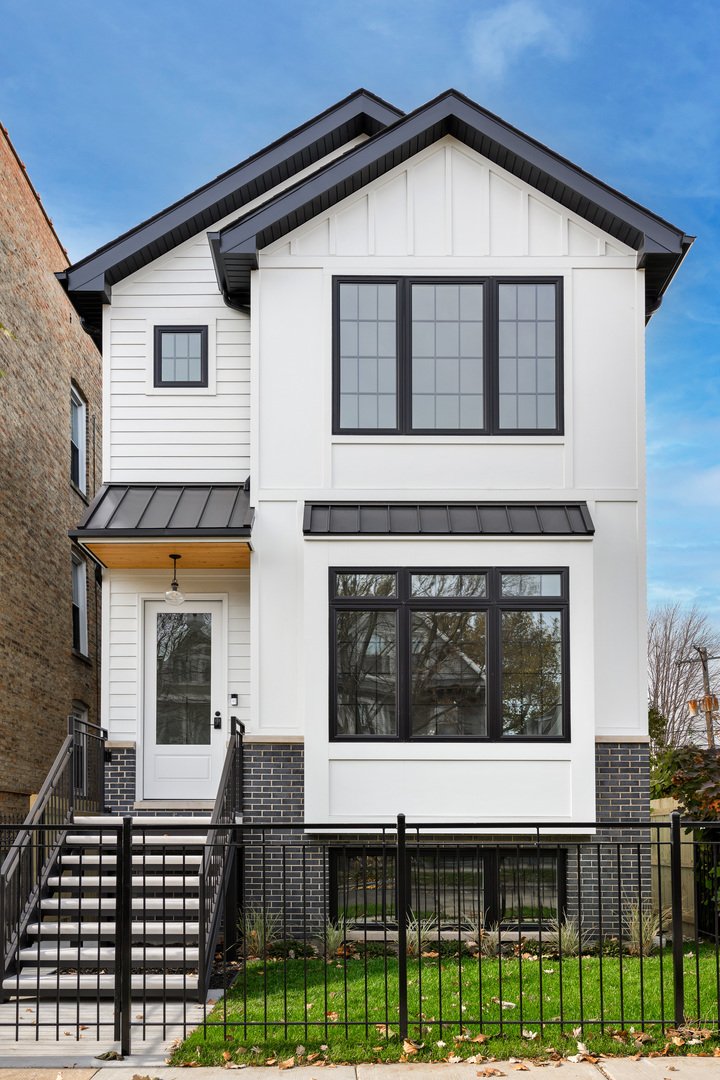 New Construction on an extra-wide lot allows for a more spacious interior and features 5 bedrooms, 4.5 bathrooms, and a large 2-car garage with rooftop deck and electric car outlet. First floor boasts an open floor plan, 10' ceilings, 1 half bath, wet bar, full-height white cabinetry, Sub-Zero/Wolf appliances, quartz countertops, marble backsplash, and a walk-in pantry. Second floor offers 3 bedrooms, each with its own en suite bathroom, and generous closet space, including a his-and-hers walk-in closet for the master suite. The master bathroom comes with a soaking tub, smart bidet toilet, Hansgrohe rain and steam shower. The laundry room is conveniently located on the second floor and equipped with a Samsung washer/dryer. Oak hardwood floors extend throughout the first and second floors. Ceiling speakers and voice controls are installed throughout the house. The basement features hydronic floor heating, a recreation room with a large wet bar and beverage cooler, a full bath, two bedrooms, and a second laundry room. The mudroom is located on the ground level, and the yard is fully fenced in. This home enjoys a prime location in a great neighborhood, close to trendy restaurants, shops, transportation, Horner Park, McFetridge Sports Center and the 312 RiverRun. Expected completion is November 2025