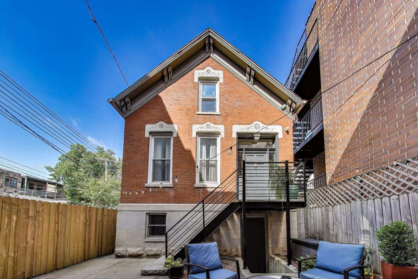 Rare, Updated Coach House in Ukrainian Village - A Peaceful Urban Retreat  Tucked away from the street, 918 N. Winchester Ave. is a rarely available freestanding coach house offering privacy, quiet, and charm in the heart of Ukrainian Village. This beautifully updated 1890 Workman's Cottage blends historic character with thoughtful modern upgrades across approximately 2,400 sq ft of living space.  Set off the street, this standalone home is remarkably quiet, providing a true urban oasis just steps from the best of East Village and Wicker Park-restaurants, shops, and public transit all within easy reach.  This home is part of a professionally managed condo association with just four owners, ensuring well-maintained common areas and a strong sense of community. All four units in the association are owner-occupied.  Inside, enjoy newly refinished hardwood floors on the first and second levels, a gas fireplace, and an updated kitchen with brand-new stainless steel appliances-refrigerator, oven/range, microwave, and dishwasher. The sunlit second floor features multiple skylights and a convenient second washer/dryer adjacent to the primary suite.  The home boasts three full bathrooms, all with luxurious heated floors, including a spa-like lower-level bath with jacuzzi tub. The fully finished basement has its own  entrance, new flooring, a mini bar, a full sized washer/dryer, and works perfectly as a guest suite, in-law apartment, or flexible living space.  Storage is abundant, with plenty of closets throughout and additional dedicated storage space in the front building's basement.   Relax or entertain in the shared courtyard patio, which has cozy seating, a fire pit, and beautifully maintained foliage in the summer months!  Recent mechanical updates include a new HVAC system (2023) and new water heater (2023). Street parking is a breeze thanks to the neighborhood permitting, and the welcoming neighborhood community completes the package.  This move-in-ready coach house offers a unique combination of historic charm, modern luxury, quiet privacy, and professional management in one of Chicago's most desirable neighborhoods.
