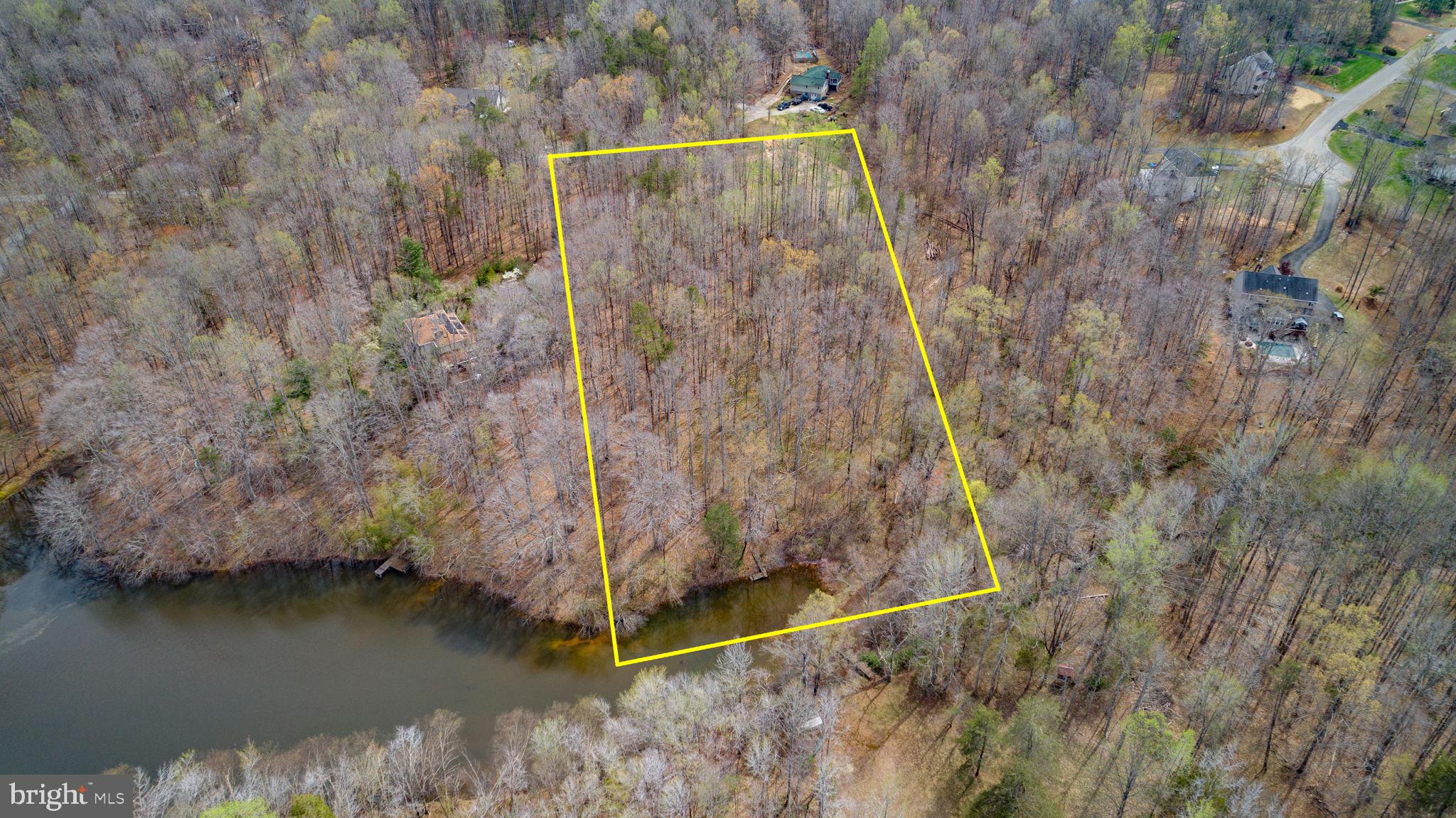 It doesn’t come along often, but here’s a rare 5-acre parcel off Gordon Road, just 5 miles from Route 3. The small community of River Will is comprised of only 37 five-acre homesites, offering space and privacy that’s hard to find. This wooded lot, filled primarily with hardwoods, slopes gently down to the water and is an ideal setting for a walkout basement. Several of the lots surround a beautiful pond, creating a peaceful setting where access is limited exclusively to the homeowners who live along its shores. With abundant wildlife and a serene natural backdrop, this is a perfect place to build your dream home. Conventional 4BR perc feasibility study available.