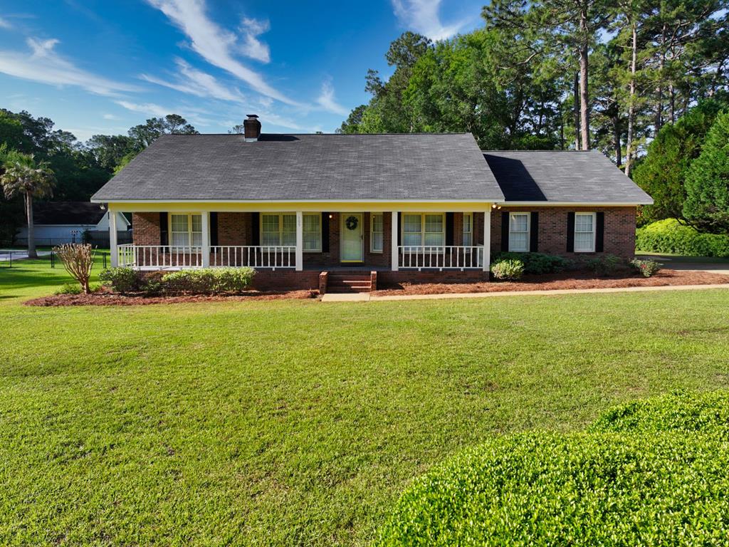Welcome to 109 Northwoods, a well-maintained home nestled in a quiet, established neighborhood just minutes from everything Thomasville has to offer. Located only 4 miles from charming downtown Thomasville and less than 3 miles from Publix, this home delivers convenience with a peaceful setting.  Inside, you'll find three comfortable bedrooms and two full bathrooms. The spacious main suite is filled with natural light, creating a relaxing retreat at the end of the day. The full galley-style kitchen includes an eat-in area that's perfect for casual dining and morning coffee.  Enjoy the warmth of a fireplace in the inviting living area, or step outside to the screened-in porch—a perfect spot for relaxing and entertaining year-round. This home is also conveniently located near local schools, making it ideal for families or anyone seeking both comfort and location.  Don't miss this opportunity to own a charming home in one of Thomasville's most desirable areas.