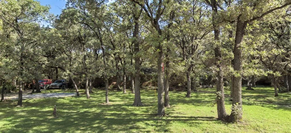RARE opportunity of 1.59 acres on a highly sought after quiet cul-de-sac street in Grapevine! This calm established tree lined street tucked away alongside the best of city conveniences makes this neighborhood a true gem. House that sits on the property is being sold as-is. Seller started remodel and will not be able to complete the process. Additional features include a detached workshop with electricity. Roof is approximately 4 yrs old per seller. City sewer hookups are available (property currently on septic). Seller will reserve mineral estate.10 minutes to DFW International Airport, 7 min to historic downtown Grapevine