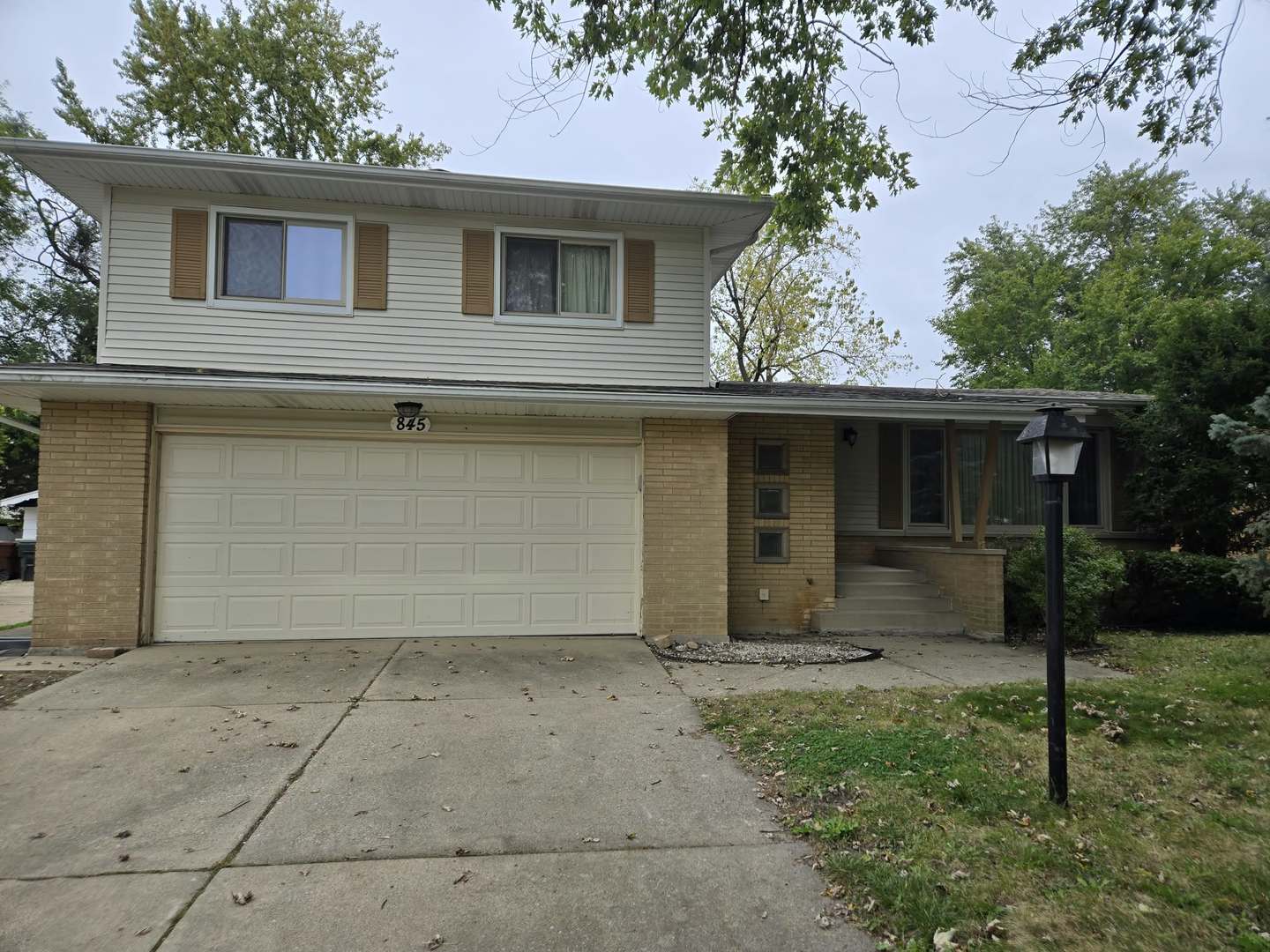 Spacious Split-Level Home with Sub-Basement and Walk-Out Lower Level!    Discover the potential in this 3-bedroom, 2-full-bath split-level home offering multiple levels of living space and a functional floor plan. The main level features beautiful wood floors and a combination living and dining room, perfect for everyday living and entertaining. The kitchen includes new appliances, adding a modern touch to the home.    The inviting lower-level family room features a cozy fireplace and patio doors leading directly to the backyard, creating a wonderful indoor-outdoor connection. An additional sub-basement provides extra space for storage.    Outside, enjoy a fenced backyard surrounded by mature trees, offering a peaceful setting for relaxing, gardening, or outdoor gatherings. A 2-car garage completes this property.    With its versatile layout, desirable features, and plenty of potential, this home is ready for its next chapter!    Property is being sold AS-IS. Seller will make no repairs.