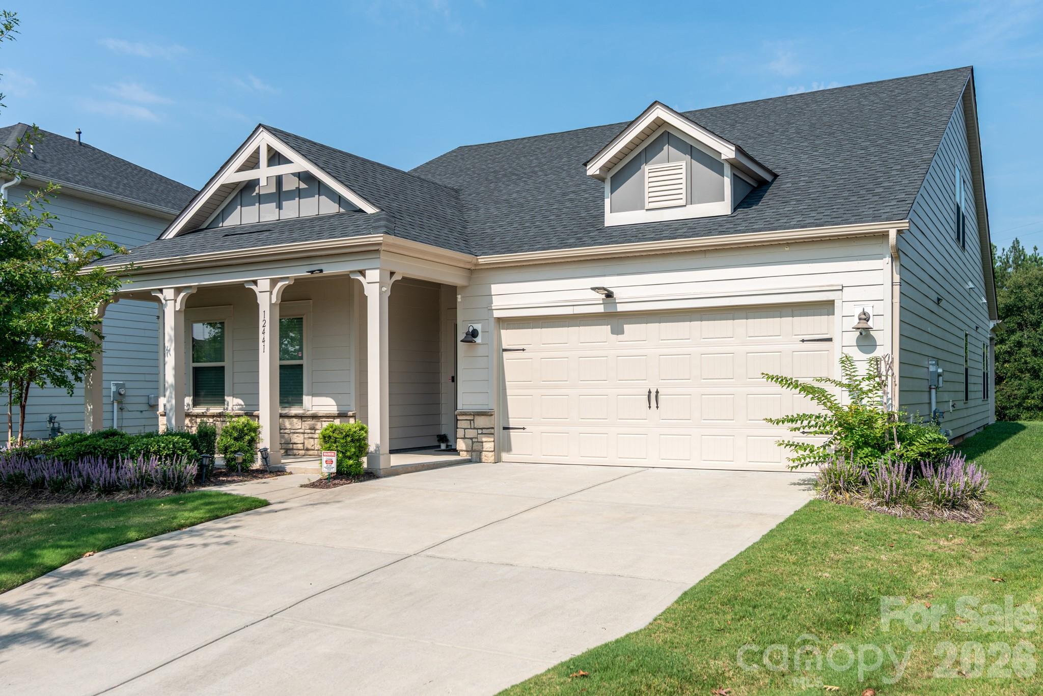 Welcome to 12441 Stoneybrook Station Parkway, where a beautifully maintained home, versatile floor plan, and exceptional location come together. Set on a premium lot with no homes directly behind or in front of it.   This 4-bedroom, 3.5-bath home offers a wonderful sense of privacy while still enjoying all the benefits of the sought-after Stoneybrook Station community. Inside, the open and airy main level is filled with natural light and features LVP flooring, a gas fireplace, and comfortable living spaces designed for both everyday living and entertaining. At the heart of the home is an impressive kitchen with an oversized granite island, abundant counter space, stainless steel appliances, and plenty of room to gather. The refrigerator, washer, and dryer convey with the home. A convenient drop zone just inside the two-car garage helps keep everyday essentials organized. The main-level primary suite is a relaxing retreat with a tray ceiling, spacious bath, and generous closet space. Two additional bedrooms share a convenient Jack-and-Jill bath, while a separate flex room can easily serve as a home office, fitness room, playroom, craft space, or whatever best suits your needs. The centrally located laundry room adds another layer of convenience to the thoughtful main-level layout. Upstairs provides even more flexibility with a private fourth bedroom, full bath, and large bonus room—an ideal setup for overnight guests, a teen suite, media room, or second living area. Fresh interior paint and professionally steam-cleaned carpeting give the home a crisp, well-cared-for feel. Outside, enjoy both a welcoming covered front porch and covered rear patio overlooking the level backyard. Stoneybrook Station residents enjoy a resort-style community pool, playground, barbecue area, sidewalks, and streetlights. The location is hard to beat, with convenient access to I-77, Birkdale Village, Lake Norman, shopping, dining, and Charlotte. Adding even more to the area's appeal is the new Town1 development  - a pedestrian-focused urban center planned around a walkable village core with approximately 75,000 square feet of restaurants and retail. Beautifully maintained, move-in ready, and positioned on one of the community's more private lots, 12441 Stoneybrook Station Parkway offers the space, flexibility, and location today's buyers are looking for. Professional measurements and floor plan will be uploaded 08/27/2026