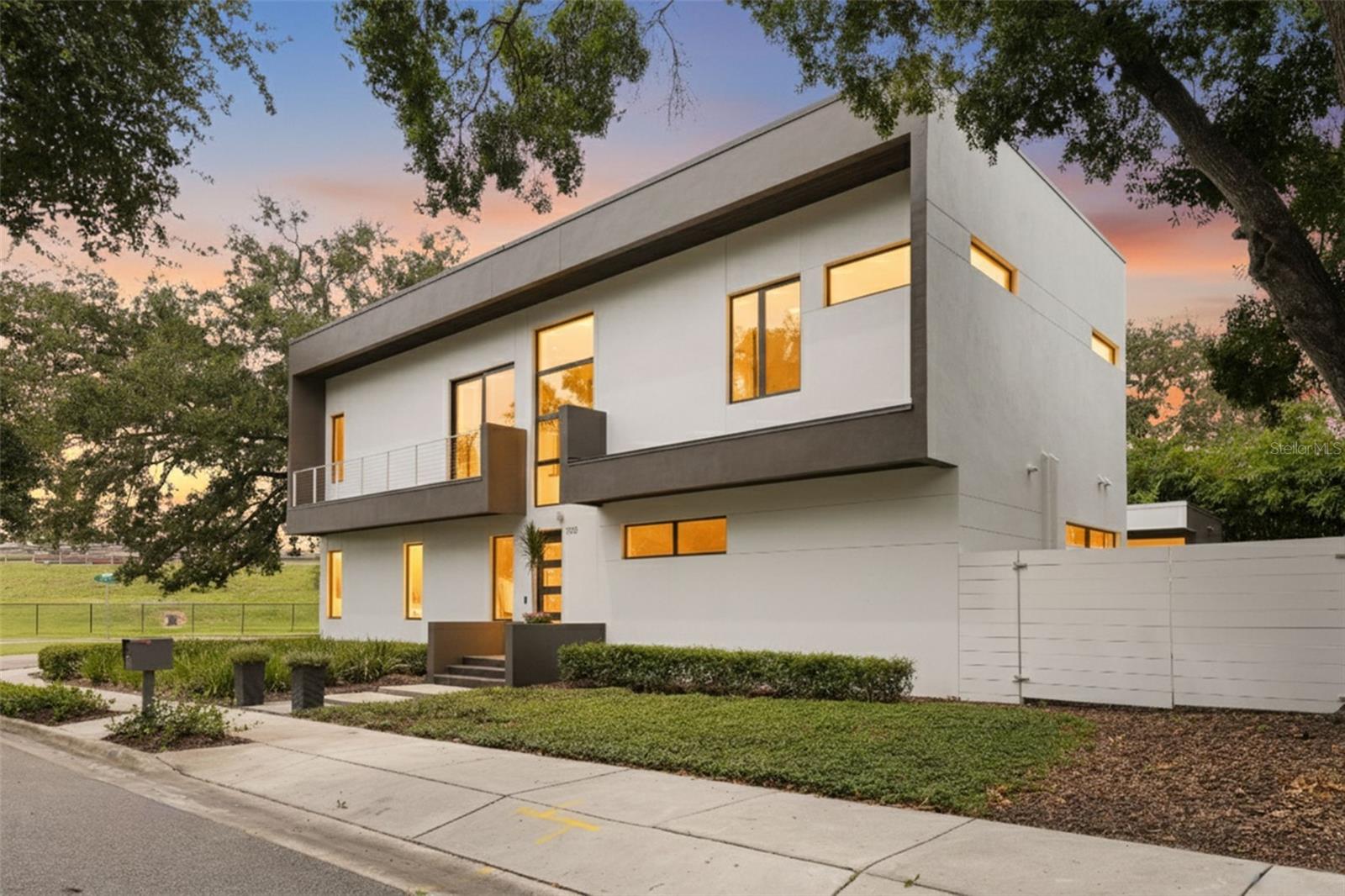 This stunning residence stands just steps from the highly coveted Waverly Park Circle. It’s distinguished by its exceptional quality and modern architecture. Thanks to two-story block construction, level 5 drywall application, sand-smooth stucco, and impact-resistant windows and doors, the home is not only visually stunning but also meticulously crafted. Built as a personal residence by the architect and builder of custom homes, Domain Development (D2), every detail has been artfully selected.  Designed with gatherings in mind, the home features a formal dining room with a custom table for fabulous dinner parties and a spacious family room perfect for fun holiday celebrations. When the festivities move outside, sliding open the wall of glass doors transforms the indoor living space into an outdoor sanctuary. Guests can enjoy the saltwater pool and spa, gather at the bar beside the fully equipped outdoor kitchen, or relax by the fire in the outdoor living area. Alfresco dining is easily accommodated with a dedicated table. Back inside, the kitchen will impress even the most discerning chef. Features include a Jenn air gas cooktop, dual built-in ovens, a Subzero refrigerator, and large island with extra storage and seating. The sleek, modern design of the custom cabinets and counters is easy to maintain, thanks to the walk-in working pantry with appliance counter and shelving. Other benefits to the home include a downstairs primary bedroom suite with two walk-in closets. The bathroom features a floating dual sink vanity and walk-in shower. A private study and powder bath complete the first floor. Upstairs, find a reading loft flush with an abundance of natural light. There are four additional secondary bedrooms and three bathrooms. Additionally, there is an expansive laundry and bonus room. Additional highlights include a temperature-controlled wine room with space for 333 bottles, a mudroom with plumbing for a future bath, an oversized two-car garage, and pre-wiring for a generator. Convenient to downtown Tampa, Bayshore, and A rated schools. Also, it's in an X FLOOD ZONE with NO flood insurance requirements. The only challenge with buying this remarkable home is deciding how best to enjoy all it has to offer! Schedule your showing today!