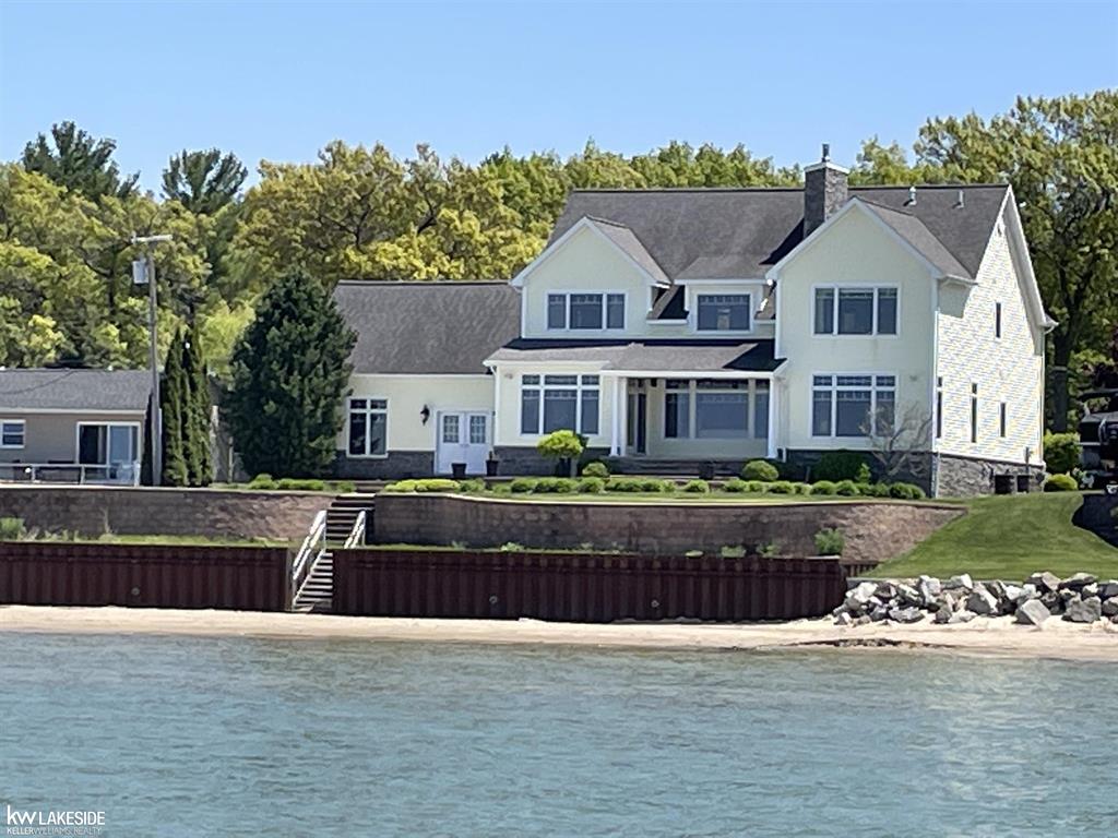 This luxury lakefront home is a fantastic property, offering a wide range of features and amenities. Here's a summary of what this home has to offer: Property Features: Location: The home is situated on a 100-foot lakefront property with a sandy beach and offers beautiful views of Saginaw Bay and Charity Island. House Features: Bedrooms: The house has 4 bedrooms, which can accommodate a significant number of guests. Bathrooms: There are 4 bathrooms for added convenience. Open Floor Plan: The open floor plan encompasses the kitchen, dining area, and living room, creating a spacious and welcoming living space. Living Room: The living room is a highlight of the home, featuring a 2-story design, a stone-faced fireplace, and a 75" TV for entertainment. Flooring: The living, dining, kitchen, and bedrooms all feature wood floors, adding an elegant touch to the interior. Kitchen: The kitchen boasts solid wood cabinets with granite countertops, along with high-end stainless steel appliances, including a Viking griddle. Additional Living Spaces: A second-floor family room overlooks the living area below, and there's extra sleeping space in the loft area adjacent to the family room, making it ideal for accommodating guests. Bonus Room: There's a bonus room above the garage, providing additional versatile space. Garage: The attached finished garage measures 24' x 24' and includes a 5' x 10' storage space on the west side. Landscaping: The property features lovely landscaping with solar lighting and underground sprinklers, enhancing its curb appeal. Lakefront Patios: You'll find both covered and uncovered concrete patios on the lake side, perfect for enjoying the waterfront views. The Basement has been finished with a Living / Entertainment area and two special use rooms. This luxurious lakefront home offers a combination of comfort, functionality, and stunning natural surroundings, making it an ideal property for those looking for a retreat or a vacation home. The various amenities and features listed above make it a great p