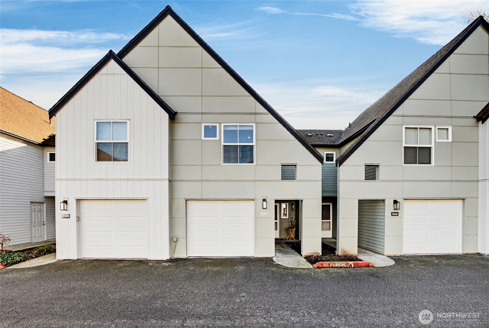 Welcome to a bright and inviting townhome that blends comfort, style, and everyday convenience. Step inside to soaring vaulted ceilings and abundant natural light that create an open, uplifting atmosphere. The thoughtfully designed kitchen offers generous counter space and a welcoming breakfast bar, making cooking and entertaining effortless. This home features two spacious ensuite bedrooms, each with its own private bathroom—perfect for roommates, guests, or anyone who values personal space and comfort. Wide-plank flooring adds a clean, modern feel throughout the main living areas, and a private one-car garage provides secure parking and additional storage. Located in the heart of downtown Kent, this home puts you close to everything. You’re just a few blocks from Kent Station, offering quick access to transit, dining, shopping, and entertainment—an ideal setup for commuters and anyone who enjoys a walkable lifestyle. The community offers an impressive lineup of amenities, including a clubhouse, fitness center, sports court, and an outdoor pool for summertime relaxation. Whether you’re unwinding after work or enjoying a weekend at home, there’s something for everyone. Exciting exterior upgrades are also on the horizon, including new siding, windows, doors, and gutters. These improvements will enhance curb appeal, improve energy efficiency, and support long-term property value. This townhome delivers the perfect blend of comfort, convenience, and lifestyle.