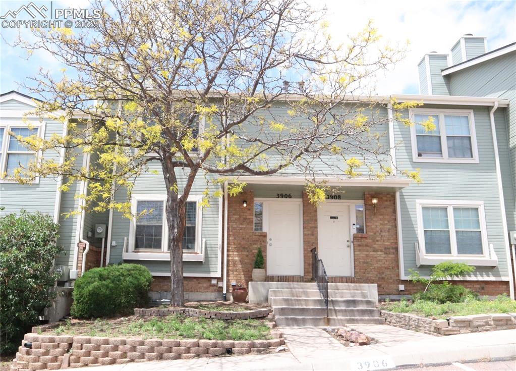 A spacious four bedroom, three bath townhouse with a brand-new roof, gutters, fresh paint, brand new carpet throughout and much more…truly maintenance free in District 20 Schools. Main level features a spacious living room with new carpet, cozy wood-burning fireplace, built-in bookcase and large window with a nice plant shelf. The open kitchen has an oversized pantry, extensive cabinets, counter space and large breakfast bar. A separate dining area with sliding glass doors walks out to the newly landscaped backyard. A large winding center staircase leads you up and downstairs. Upstairs you’ll find vaulted ceilings and plant shelves in all three bedrooms. The large master bedroom has a nice walk in closet and adjoining full bath. Full bath has a double sink vanity, skylights and built-in linen closet. The finished basement features a spacious family room, under the stairs is extra storage space, remodeled full bath, laundry room with new washer and dryer. The large fourth bedroom has a large walk in closet. The privately fenced, enclose patio is perfect for grilling and entertaining guests. Two assigned parking spaces out front and ample guest parking. The community features green space, a pet walking area, and direct access to the Woodmen Hiking Trail. You're just a short walk to grocery stores, restaurants, shops and more!