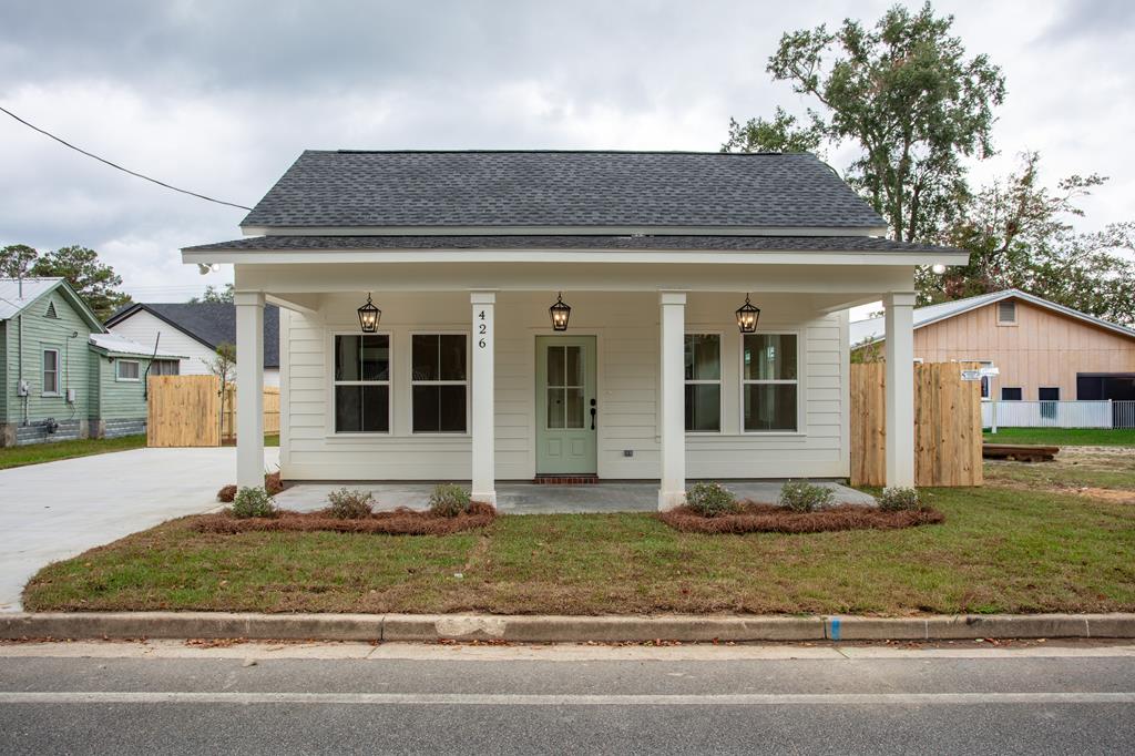 Beautiful New Cottage Near Downtown, Hospital & Paradise Park! Welcome to this brand-new 2-bedroom, 2-bath cottage perfectly located within walking distance to downtown Thomasville, Archbold Memorial Hospital, and Paradise Park. Enjoy the best of in-town living — just steps from First Fridays, local shops, restaurants, and community events — all from your own peaceful retreat.  Inside, you'll find luxury vinyl plank flooring, white soft-close cabinetry, White Pelican granite countertops, and high ceilings that create a bright and airy feel throughout. The home features a tiled tub and a luxury walk-in shower, architectural shingles, and a covered front porch that's perfect for morning coffee or evening relaxation.  The fenced-in backyard provides both privacy and functionality, making this home ideal for first-time buyers, downsizers, or anyone looking for low-maintenance living with modern finishes and small-town charm.  Quality construction, elegant design, and a prime location — this Thomasville cottage truly has it all!  Seller is a licensed real estate broker in the State of Georgia, License #340473.