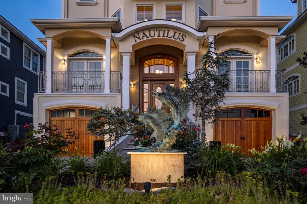 Welcome to “The Nautilus” – one of the most breathtaking waterfront properties in all of Maryland. This stunning 4-story home is located in the quiet harbor area of West Ocean City and offers unmatched views in every direction. Look out over the Ocean City Inlet, downtown skyline, Assateague Island, and the Atlantic Ocean—all from your own home. It truly feels like you’re living on a luxury cruise ship, surrounded by water and endless horizons, while enjoying the calm and privacy of the bay.  Enjoy 5 bedrooms, 3 full and 2 half bathrooms, 2 full kitchens, a private elevator, and an incredible rooftop deck with sunrise and sunset views. Step out your back door to your private dock with a boat slip and lift, giving you direct access to the water. This location offers both peace and convenience—tucked away in a quiet neighborhood but just minutes from Ocean City’s beaches, restaurants, and marinas. The Nautilus is more than a home—it’s a once-in-a-lifetime property with views you won’t find anywhere else.